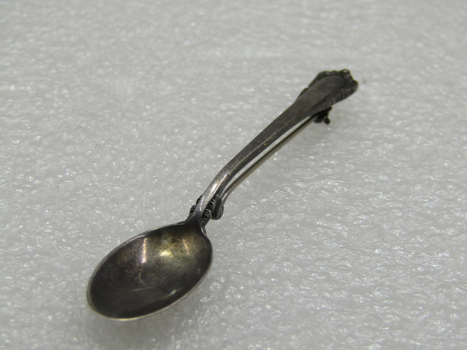 Vintage Sterling Lunt Spoon Brooch, 2.75": Vintage Sterling Lunt Spoon Brooch, 2.75" and 1/2" wide. Mid-Century. Weight is appx. 4.56 gr. Very good condition, light oxidation. (W12321.8 SS6245 J LD 2/1/22). Reserve: $30.00 Shipping: Domestic: 