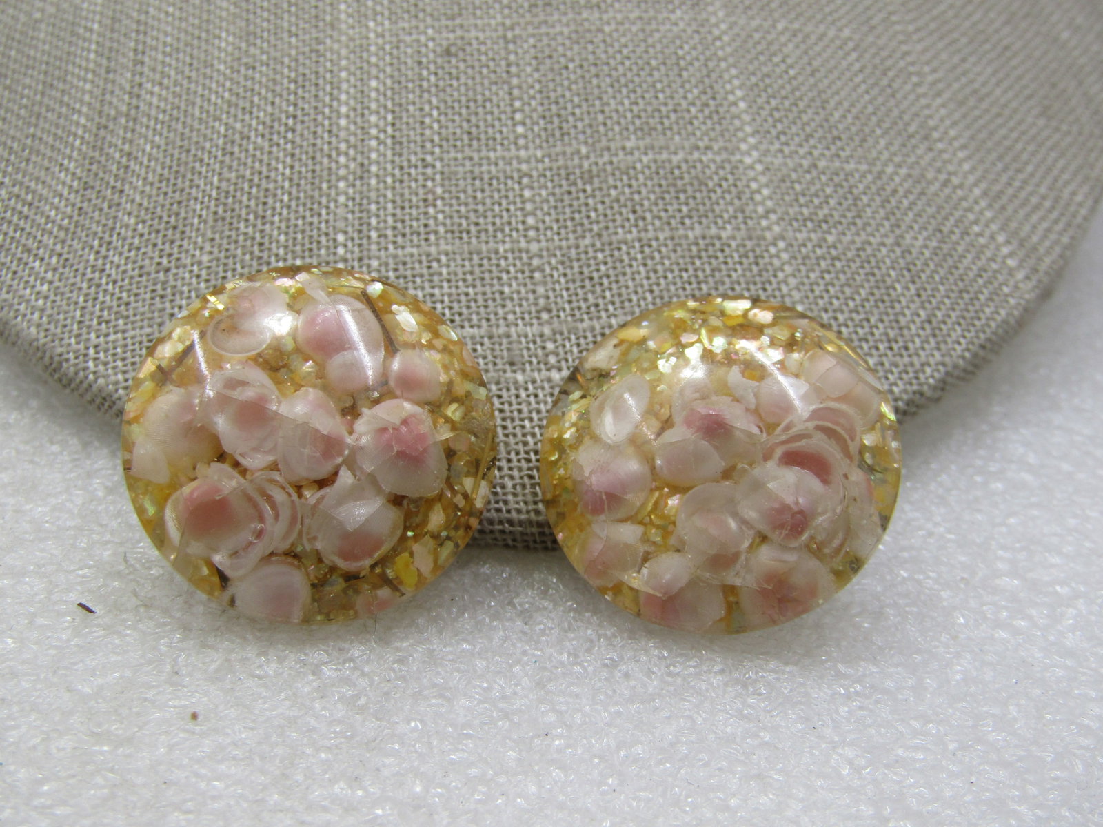 Vintage Seashell Clear Lucite Clip earrings, 1", 1950's-1960's: Vintage Seashell Clear Lucite Clip earrings, 1", 1950's-1960's. Round and domed clear lucite with small pink and white seashells set in the lucited, smooth on top, Brass clips. Good to very good