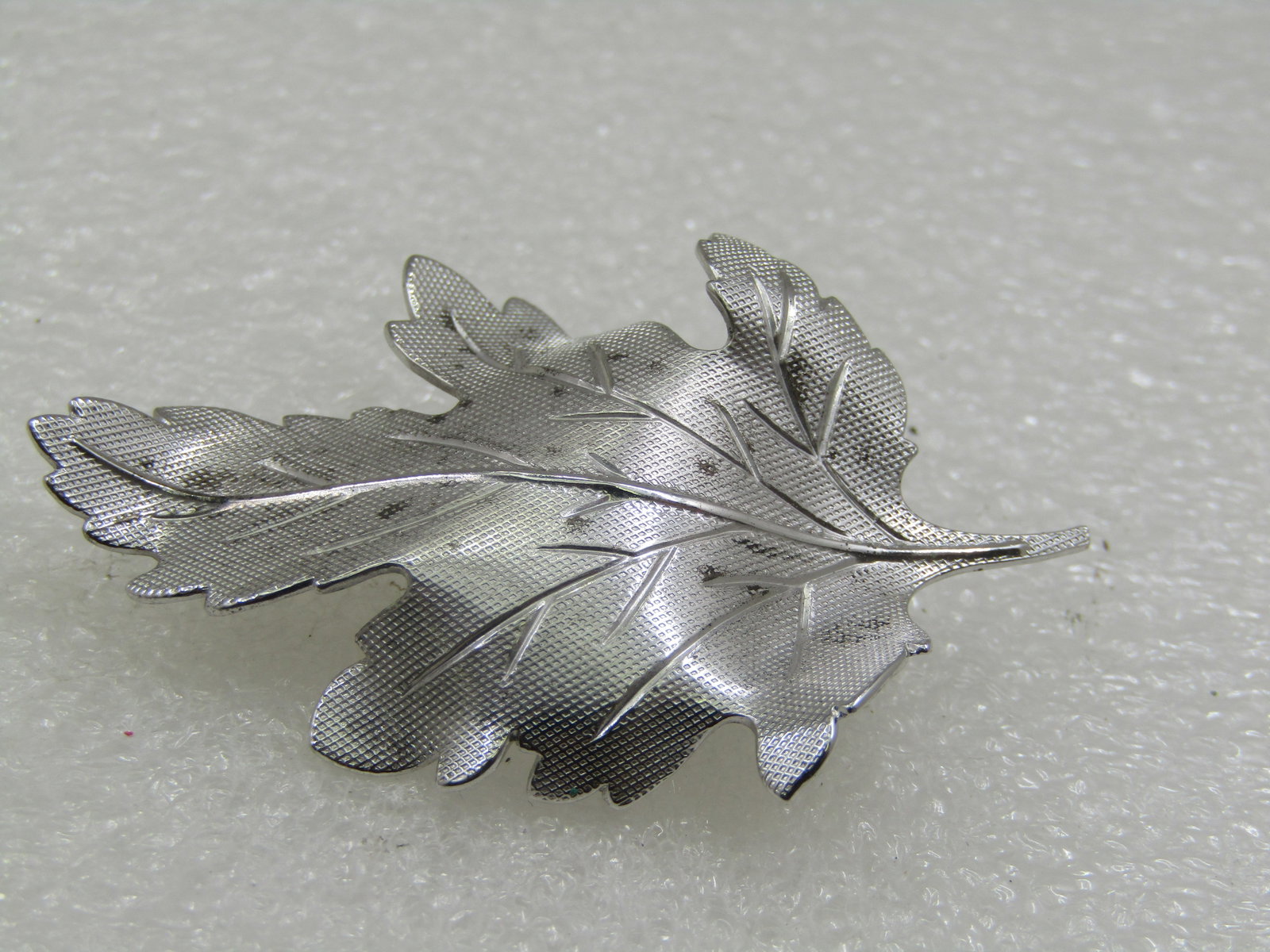 Vintage Sterling Carl Art Leaf Brooch, 1960's,: Vintage Sterling Carl Art Leaf Brooch, 1960's, 2.25" tall and 1.25" wide. 3-D curved textured leave with cut accents and raised veins. 1960's. Very good condition. Signed with the Cart Art hallmark an