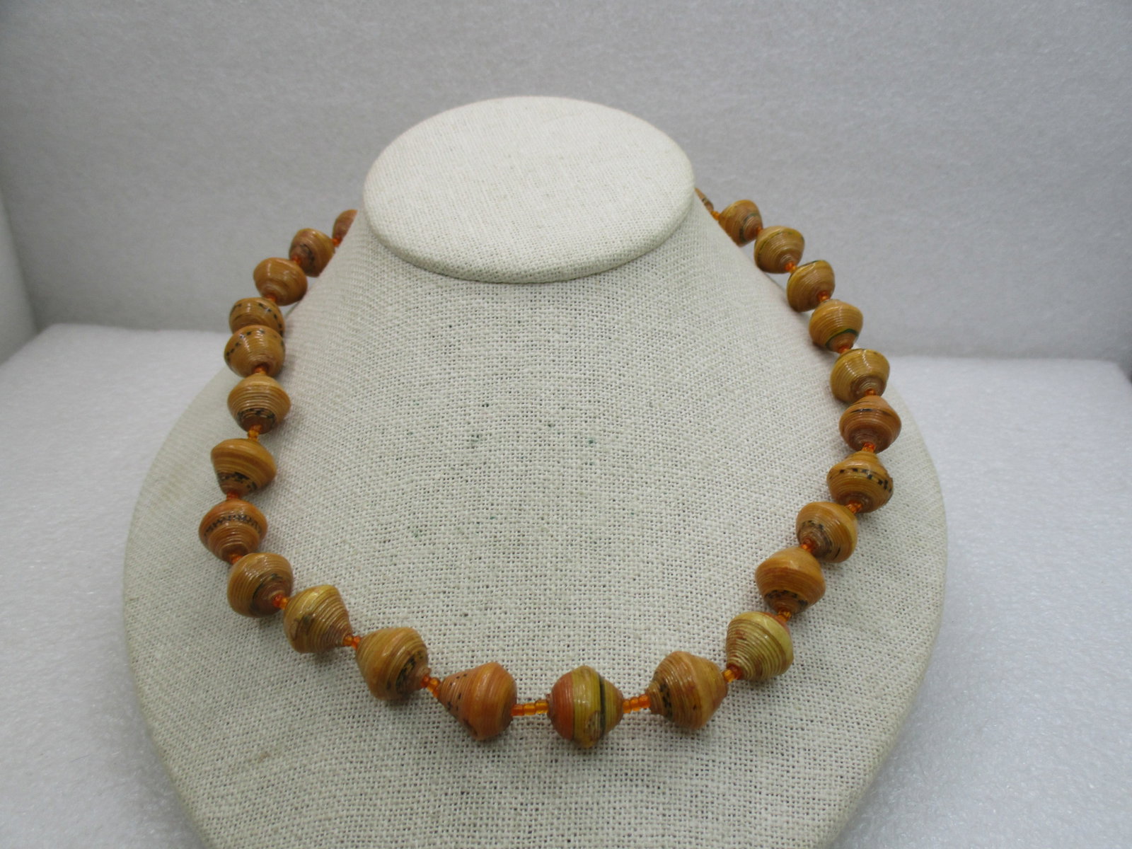 Vintage Tan Celluloid/Plastic Beaded Necklace 19.5", Conical Beads, Wrapped Design, Mid-Century: Vintage Tan Celluloid/Plastic Beaded Necklace 19.5", Conical Beads, Wrapped Design, Mid-Century. The beads are appx. half-inch wide at the center and come to a point on both ends - somewhat irregular