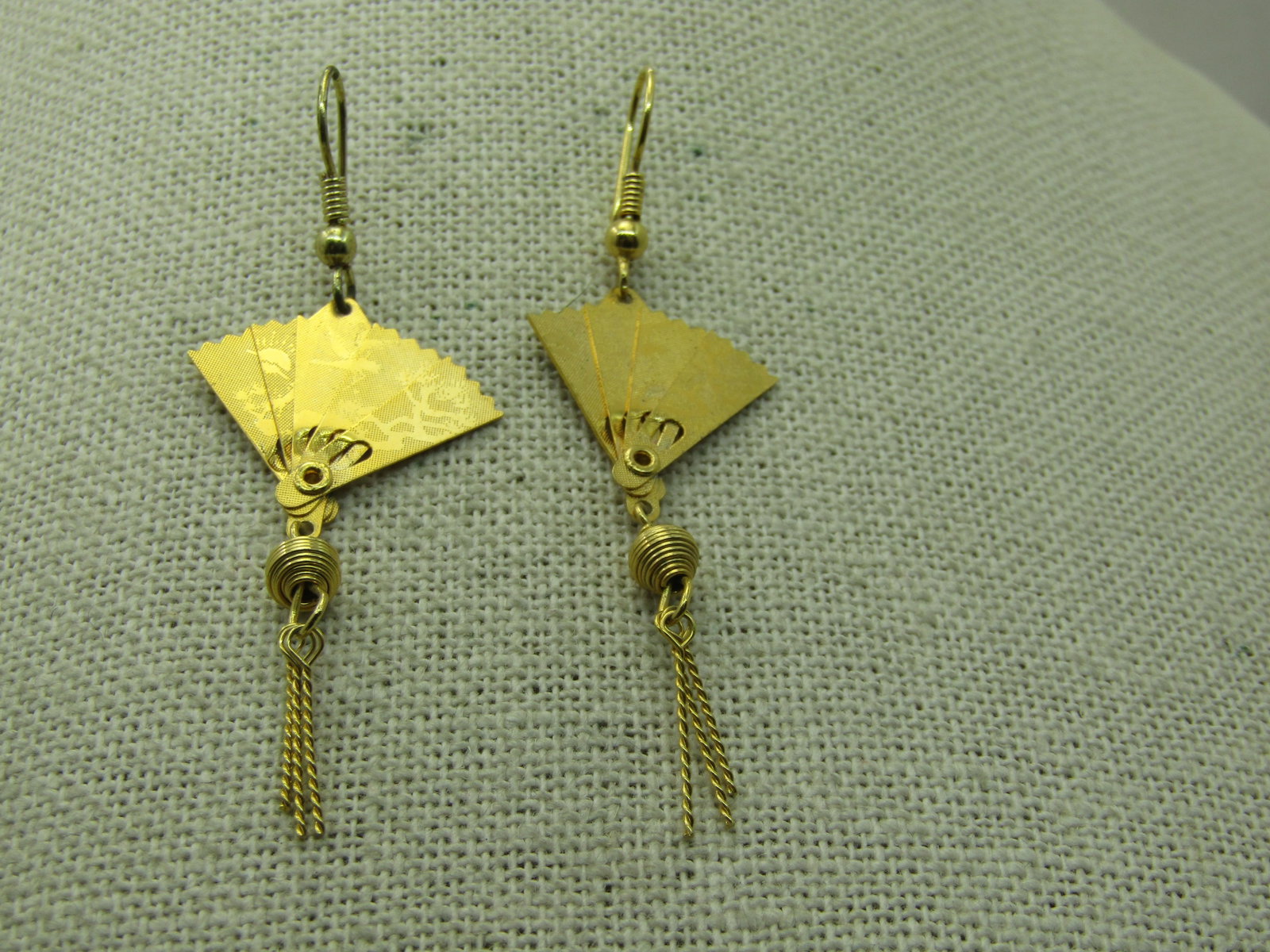 Vintage Folding Japanese Fan Earrings, Pierced, Gold Tone, Tassels, 2.25": Vintage Folding Japanese Fan Earrings, Pierced, Gold Tone, Tassels, 2.25" tall and 1" wide. Nice Asian theme with a floral design on front and back of the earrings , can be closed or opened. Hanging