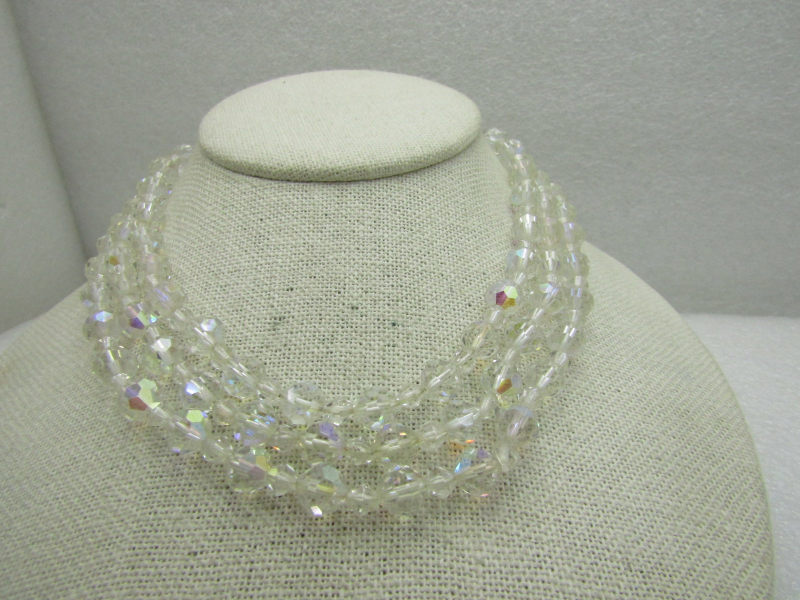 Vintage Triple Strand Aurora Borealis Beaded Necklace, Round Crystal, 16": Vintage Triple Strand Aurora Borealis Beaded Necklace, Round Crystal, 12"-14" with hook and extender chain is 16". Two of the lengths drape down from the shortest length. The round faceted chrystal be