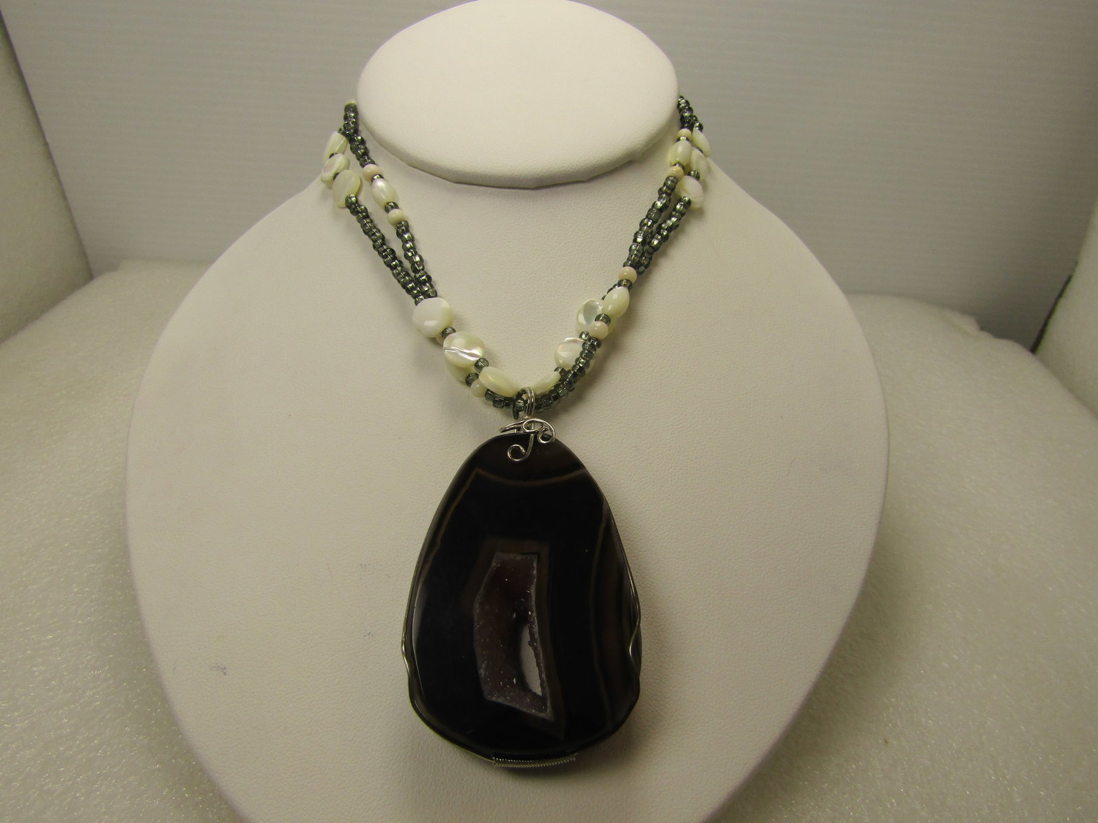 Brown Agate and Druzy Quartz MOP Necklace, Multi-Strand 28". 1980's-1990's: Brown Agate and Druzy Quartz MOP Necklace, Multi-Strand 28". 1980's-1990's. This is a 15mm thick brown/black agate with a center druzy quartz opening through the stone. Unsure of which agate this is b