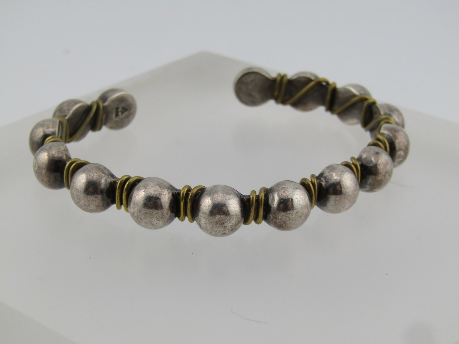 Vintage Silpada Sterling Beaded Brass Wrapped Cuff Bracelet, 6.75", 1980's: Vintage Silpada Sterling Beaded Brass Wrapped Cuff Bracelet, 6.75", 1980's. This works as a unisex bracelet also. The bracelet has half-round sterling bead like accents across the entire top fo the
