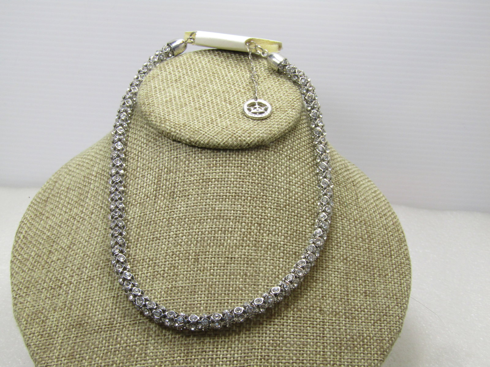 Vintage Crown Trifari Rhinestone Rondelle Necklace 16"-18" Original Tag: Vintage Crown Trifari Rhinestone Rondelle Necklace 16"-18" Original Tag. Siler tone 6.5mm round necklace with clear glass rhinestone with silver tone Crown Trifari hang tag. It is 16" with a 2" extend