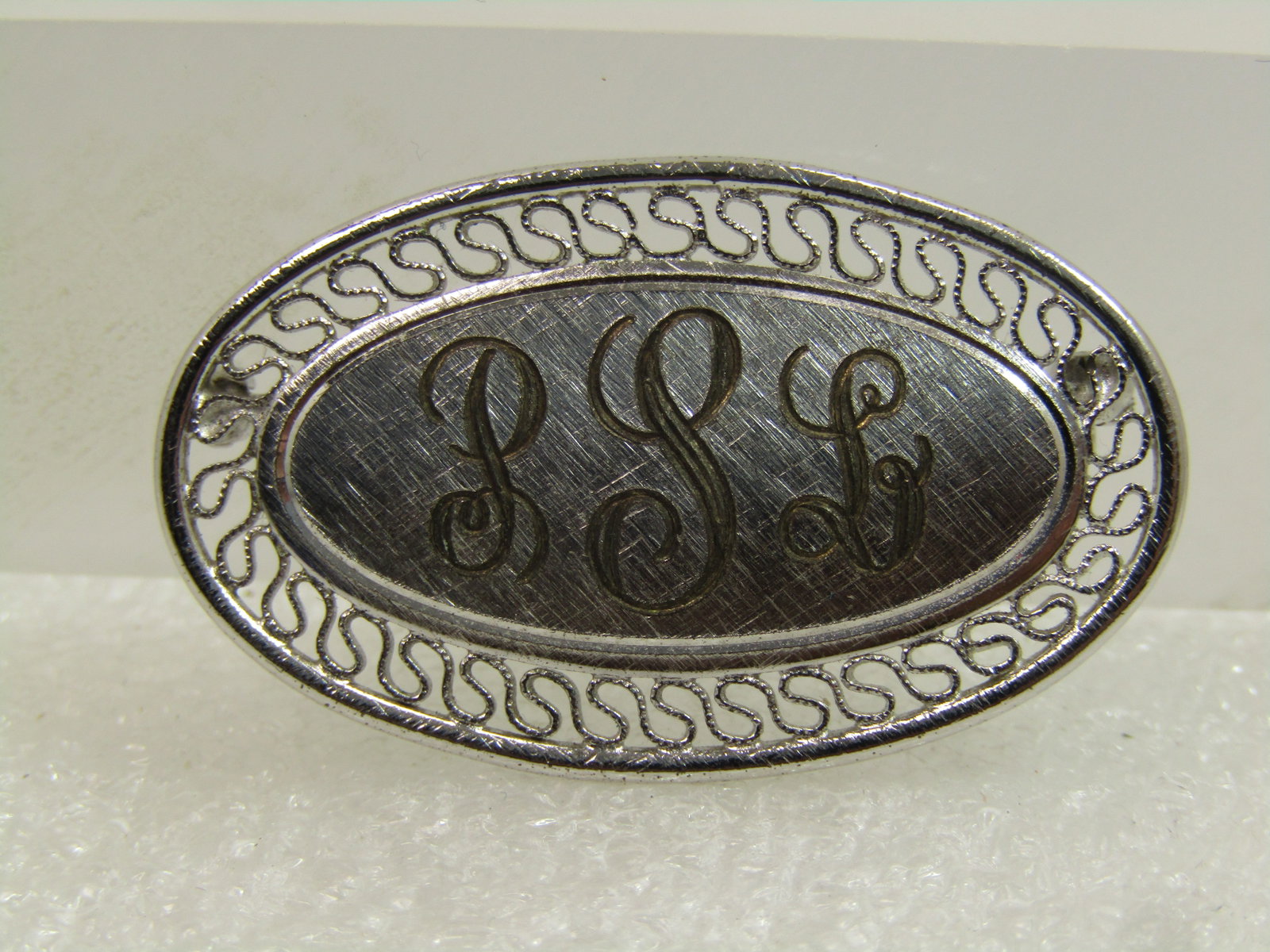 Vintage Sterling Monogrammed Brooch, P S L, Signed BAB, 1940's-1950's: Vintage Sterling Monogrammed Brooch, P S L, Signed BAB, 1940's-1950's. BAB is B.A. Ballou. This is an oval with a textured S curved the frame and brushed finish where it is slightly domed with engraed