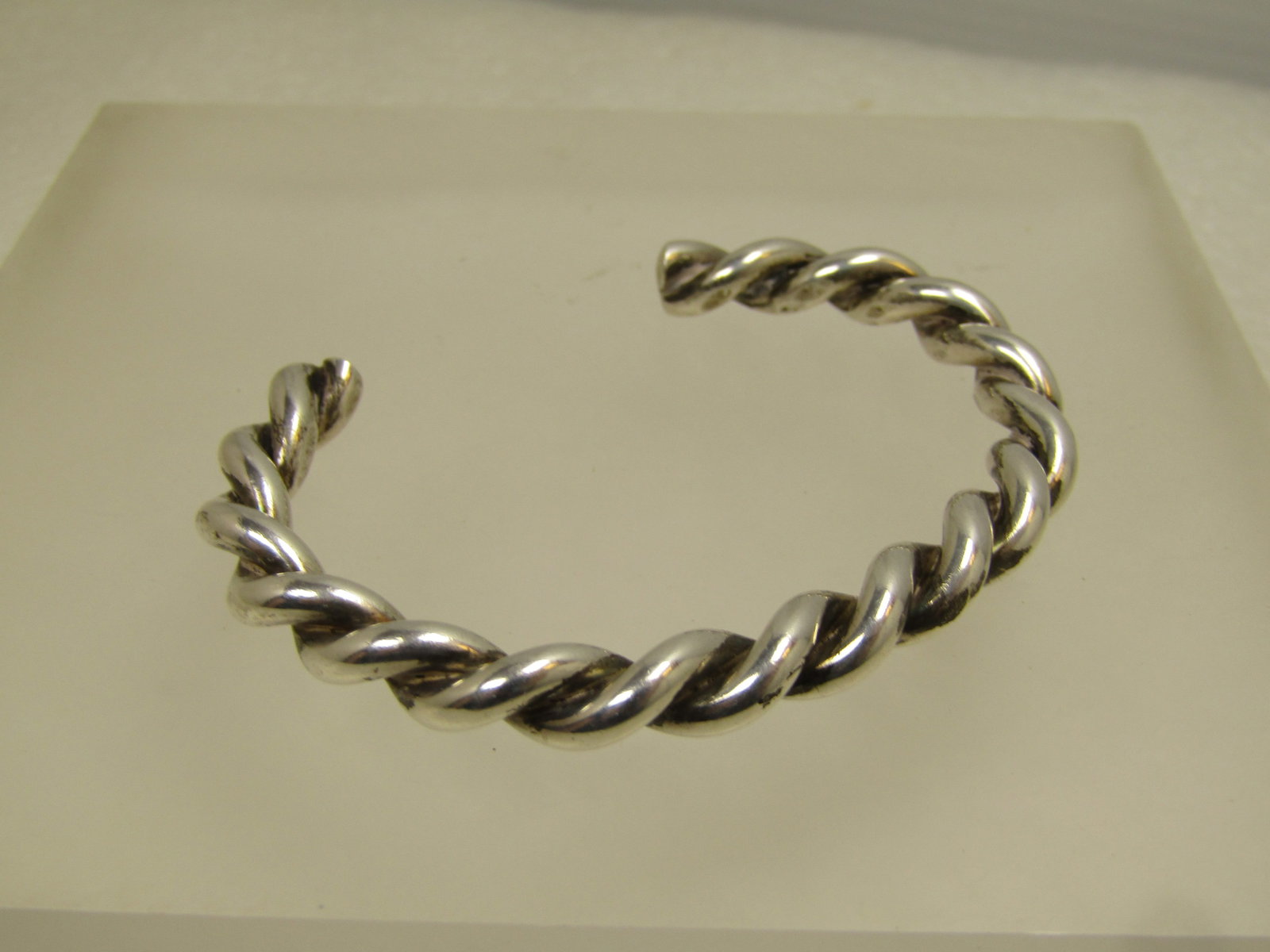 Vintage Sterling Heavy Twisted Cuff Bracelet, 5.5", 1980's-1990's: Vintage Sterling Heavy Twisted Cuff Bracelet 5.5", 1980's-1990's. This is a heavy sterling twisted bracelet that tests as sterling with an appx. weight of 25.82 grams. It is appx. 6mm thick. It has a