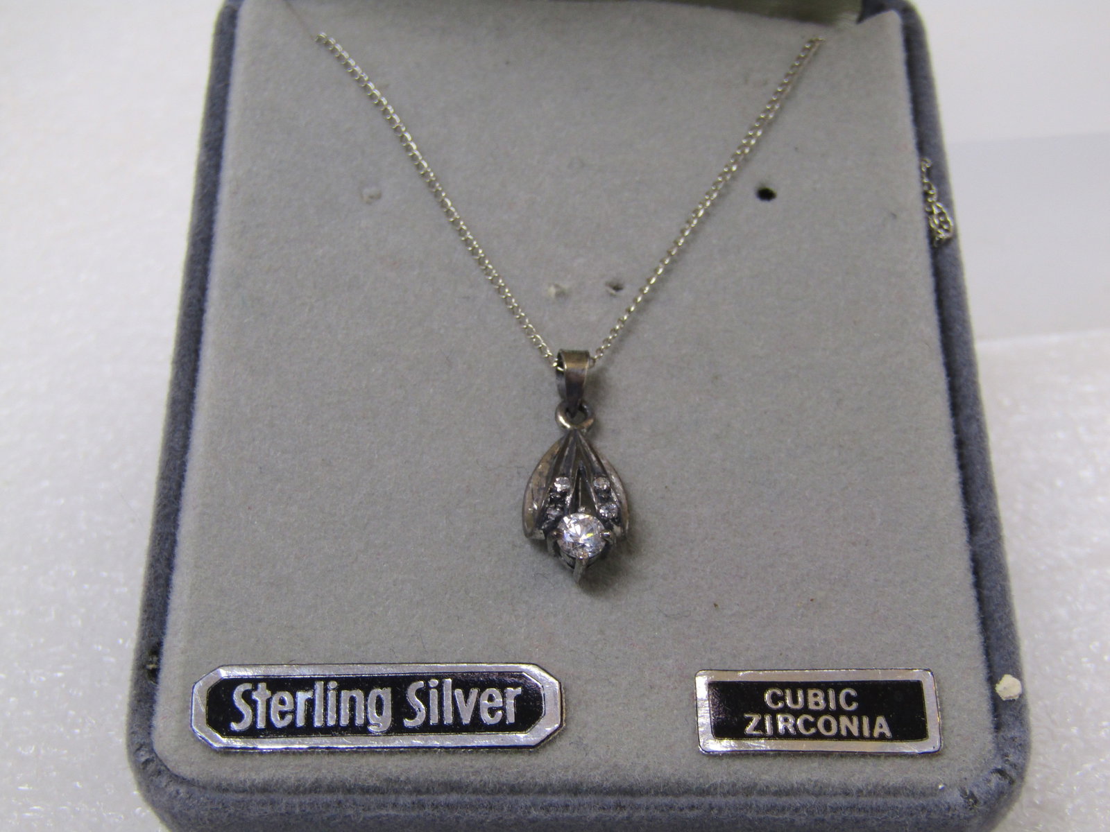 Vintage Sterling CZ Necklace, 18", Chante, Original Box, 1960's-1970's: Vintage Sterling CZ Necklace, 18", Chante, Original Box, 1960's-1970's. This has a looped 3-d pendant with a larger CZ at center and two smaller ones above. The pendant is appx. 3/4" long and is on a