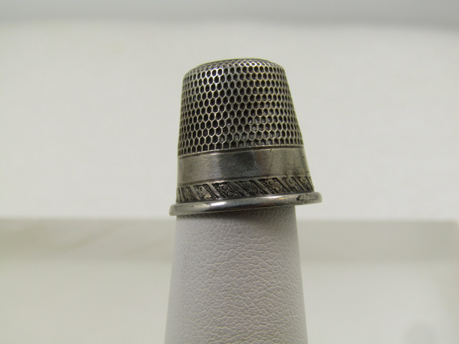 Vintage Sterling Thimble, Sz. 11. 1920's-1930's, Signed: Vintage Sterling Thimble, Sz. 10, Initials, 1920's-1930's, signed. GEM, Early 1900's, Signed with an anchor and rope maker's mark. This is appx. 3/4" tall. It is marked 10 for the size with an S