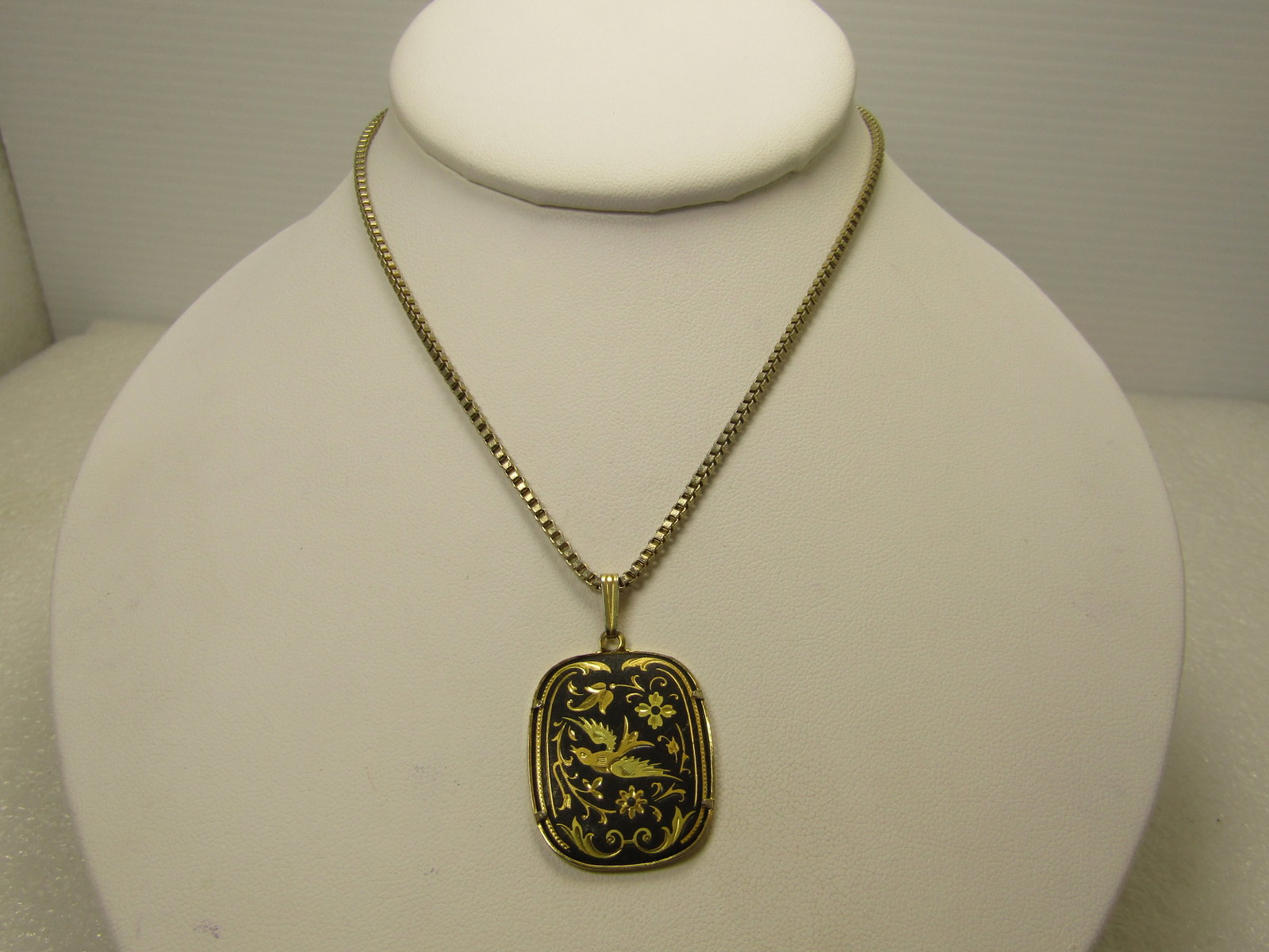 Vintage Damascene Bird Necklace, 20" Box Chain, Signed Ai, 1960's-1970's: Vintage Damascene Bird Necklace, 20" Box Chain, Signed Ai, 1960's-1970's. This has a rectangular pendant with rounded corners and a gold tone back and frame around the pendant. The pendant, with