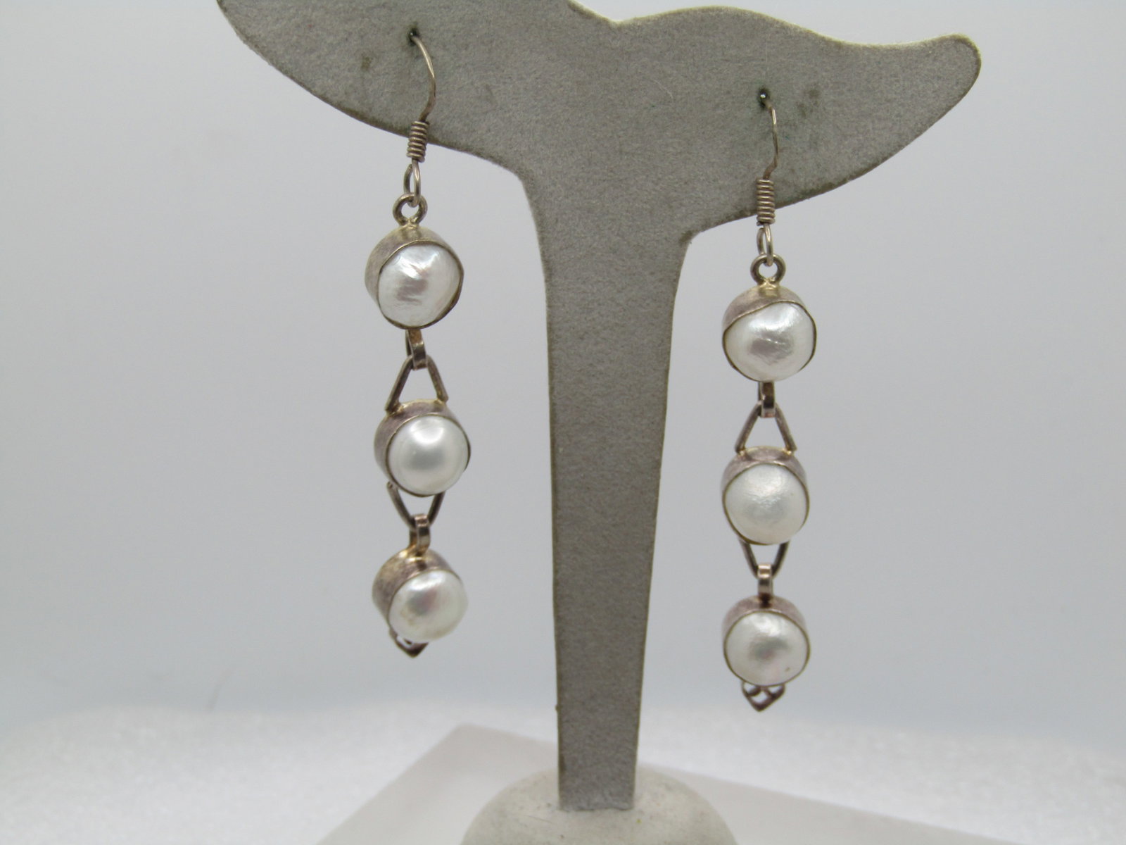 Vintage Triple Drop Freshwater Pearl Earrings, Pierced, 1980's-1990's: Vintage Triple Drop Freshwater Pearl Earrings, Pierced, 1980's-1990's. The posts are marked sterling. There are three roundish shaped pears in each earring that are bezel-set with triangular connect