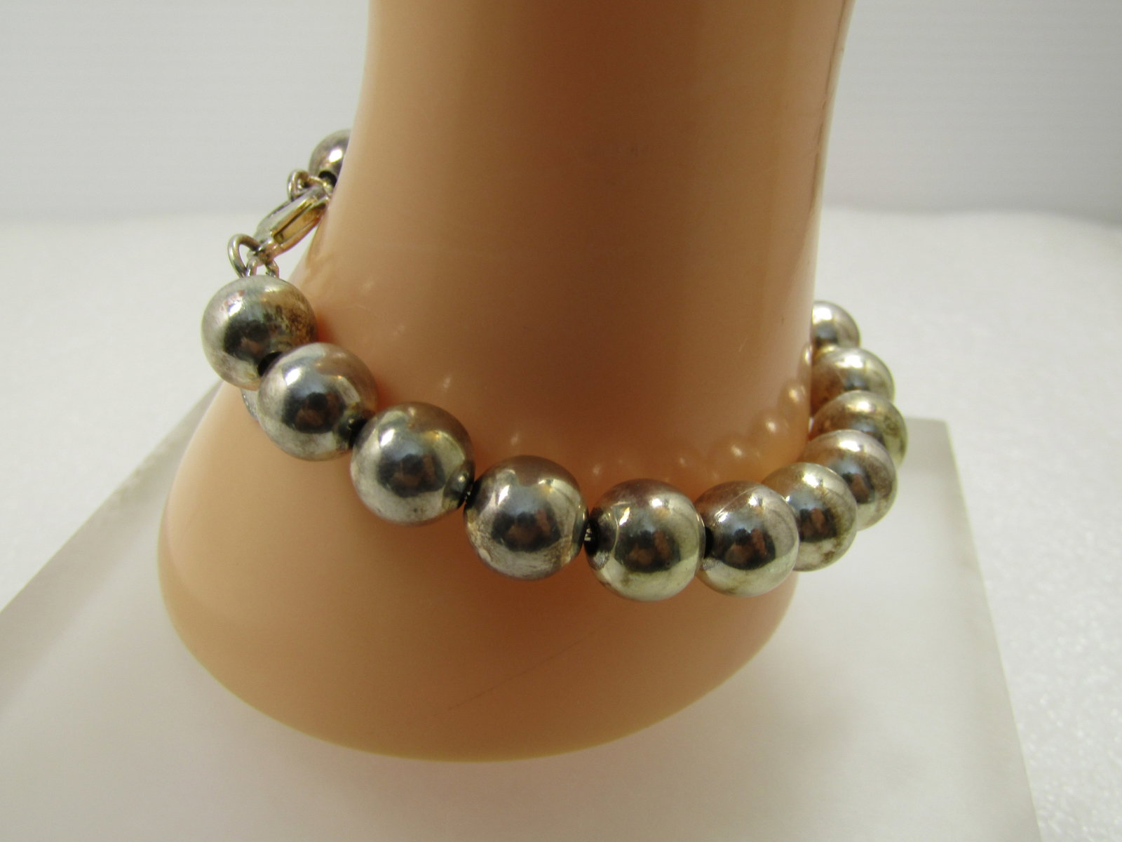 Vintage Silver Plated 9.5mm Beaded Bracelet, 8", 1990's: Vintage Silver Plated 9.5mm Beaded Bracelet, 8", 1990's. This has a lobster clasp. It has a tag and is marked .925 on the tag and the clasp but neither test as true sterling - just plated. It also has