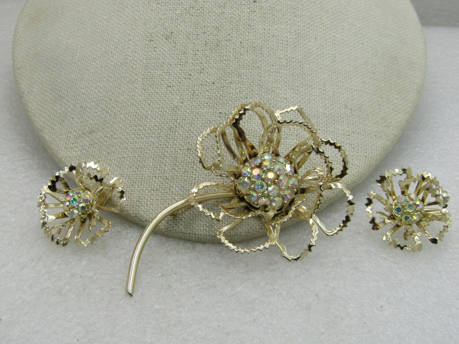 Vintage Sarah Coventry Rhinestone Floral Brooch and Clip Earrings Set 1960's-1970's: Vintage Sarah Coventry Rhinestone Floral Brooch and Clip Earrings Set 1960's-1970's, 3.5" Height Pin and Earrings Appx. 1-1/8", Gold Tone, Aurora Borealis Scalloped and raised tiered petals. Very good