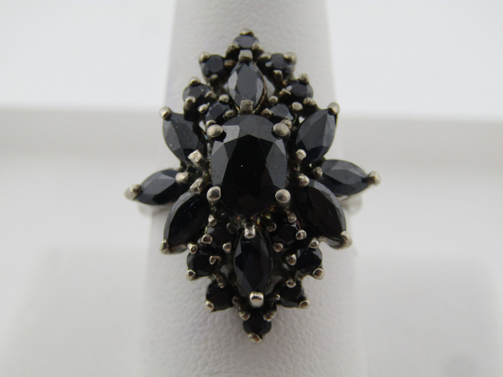 Vintage Sterling Dark Blue Sapphire/Diamond Ring, Sz. 10.5 .1980's-1990's: Vintage Sterling Dark Blue Sapphire/Diamond Ring, Sz. 10.5.This has a small 1mm diamond set at the front/back point. Age is estimtaed at 1980's-1990's. It has a lab created dark blue - almost black
