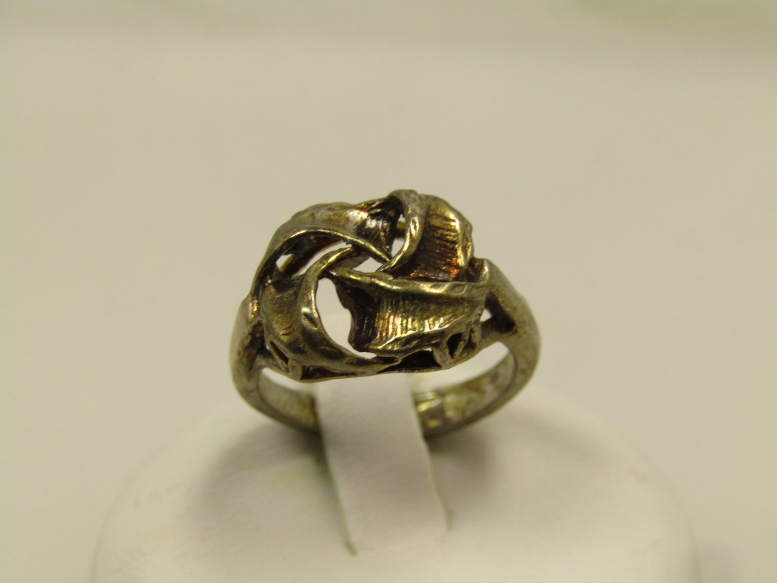 Vintage Sterling Spiral Ring, Sz. 5.5, 1980's: Vintage Sterling Spiral Ring, Sz. 5.5, 1980's. This is marked .925 and tests as sterling with a weight of appx. 3.85 grams. The ring has a spiral of four interwoven accents on top with a slightly