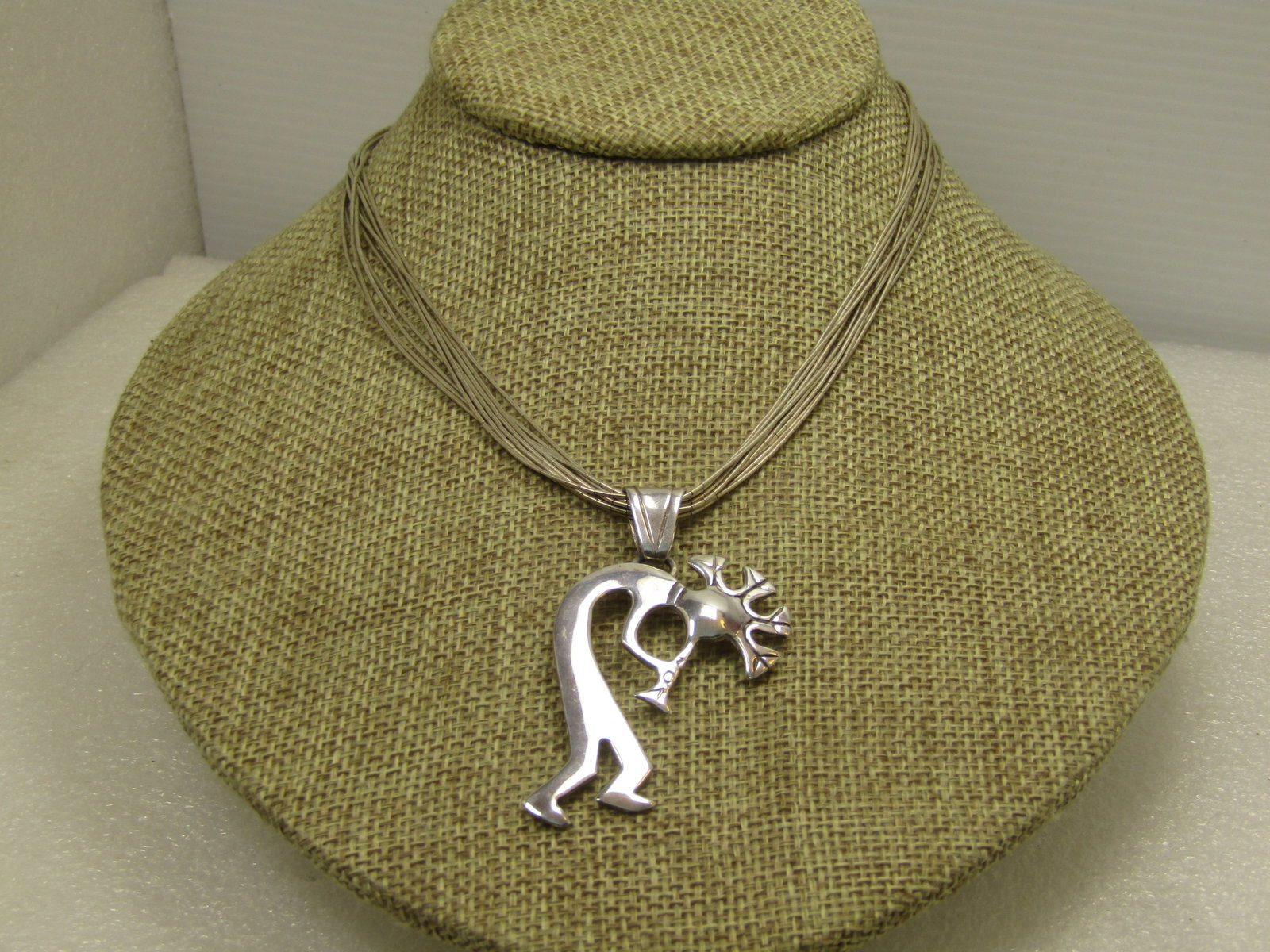 Vintage Sterling Navajo Kokopeli Ten Strand Necklace, 18", Signed GS, 1980's-1990's: Vintage Sterling Navajo Kokopeli Ten Strand Necklace, 18", Signed GS, 1980's-1990's. The pendant is signed GS and marked sterling. It has a wide swing bail and is appx. 2.25" tall and 1.25" wide. GS