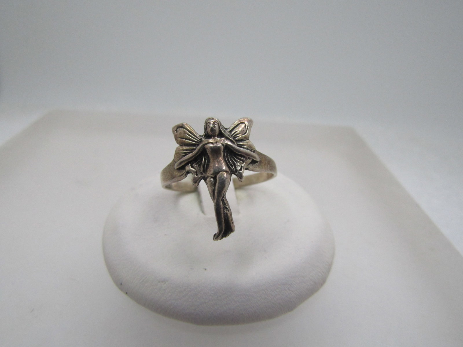 Vintage Sterling Fairy Ring, Sz. 7.5, 1980's-1990's: Vintage Sterilng Fairy Ring, Sz. 7.5, 1980's-1990's. This has a fairy top center with arms out and wings open. It is appx. 3/4" down the finger and slightly over 1/2" across the finger. The band is