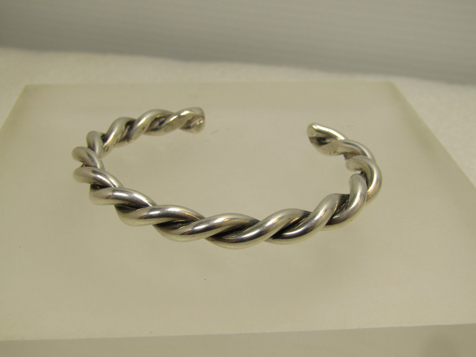Vintage Sterling Heavy Twisted Cuff Bracelet 5.75", 1980's-1990's.: Vintage Sterling Heavy Twisted Cuff Bracelet 5.75", 1980's-1990's. This is a heavy sterling twisted bracelet that te ts as sterling with an appx. weight of 25.95 grams. It is appx. 6mm thick. It has