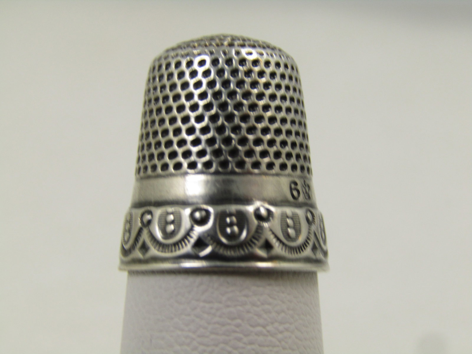 Vintage Sterling Thimble, Sz. 6, 1930's-1940's, Signed: Vintage Sterling Thimble, Sz. 6, 1930's-1940's, Signed with a crown maker's mark. It has a decorative lower band with draping design and above that a plain band that has the size 6 and rown marking. A