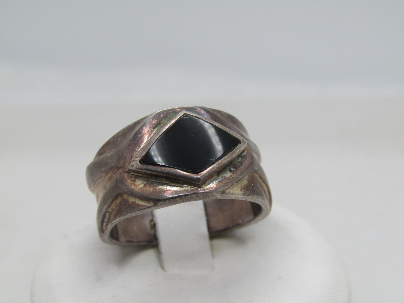 Vintage Sterling Onyx Wide Band Ring, Sz. 8.5. Unisex, 1970's-1980's: Vintage Sterling Onyx Wide Band Ring, Sz. 8.5. Unisex, 1970's-1980's. Inlaid black onyx slightly raised diamond shape that is appx. 12mm by 8.5mm. The ring is appx. 12mm down the finger at top center 