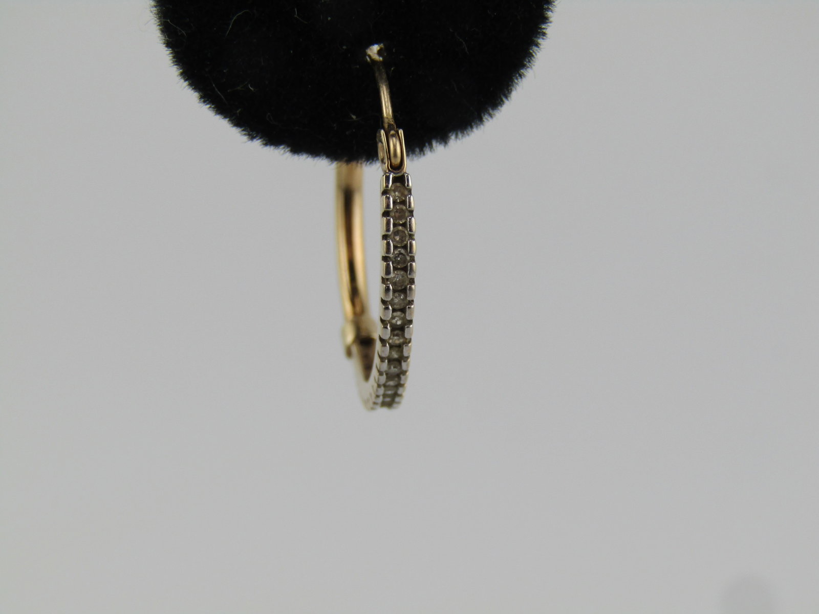 Vintage 10kt Diamond Hoop Single Earring, Pierced, Mexico, 1980's-1990's: Vintage 10kt Diamond Hoop Single Earring, Pierced, Mexico, 1980's-1990's. This is yellow gold with the front half of the hoop with appx. twenty channel set diamonds that are appx. 1mm to 1.2mm. The