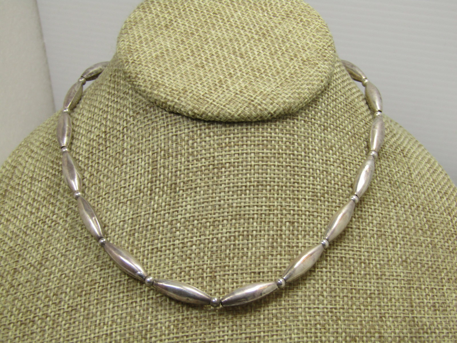 Vintage Sterling Navajo Pearl Beaded Necklace, 15.5", 1970's-1980's: Vintage Sterling Navajo Pearl Beaded Necklace, 15.5", 1970's-1980's. This has elongated beads that are each appx. 3/4" long and 5mm wide with a 3mm silver round bead between each of the longer beads.