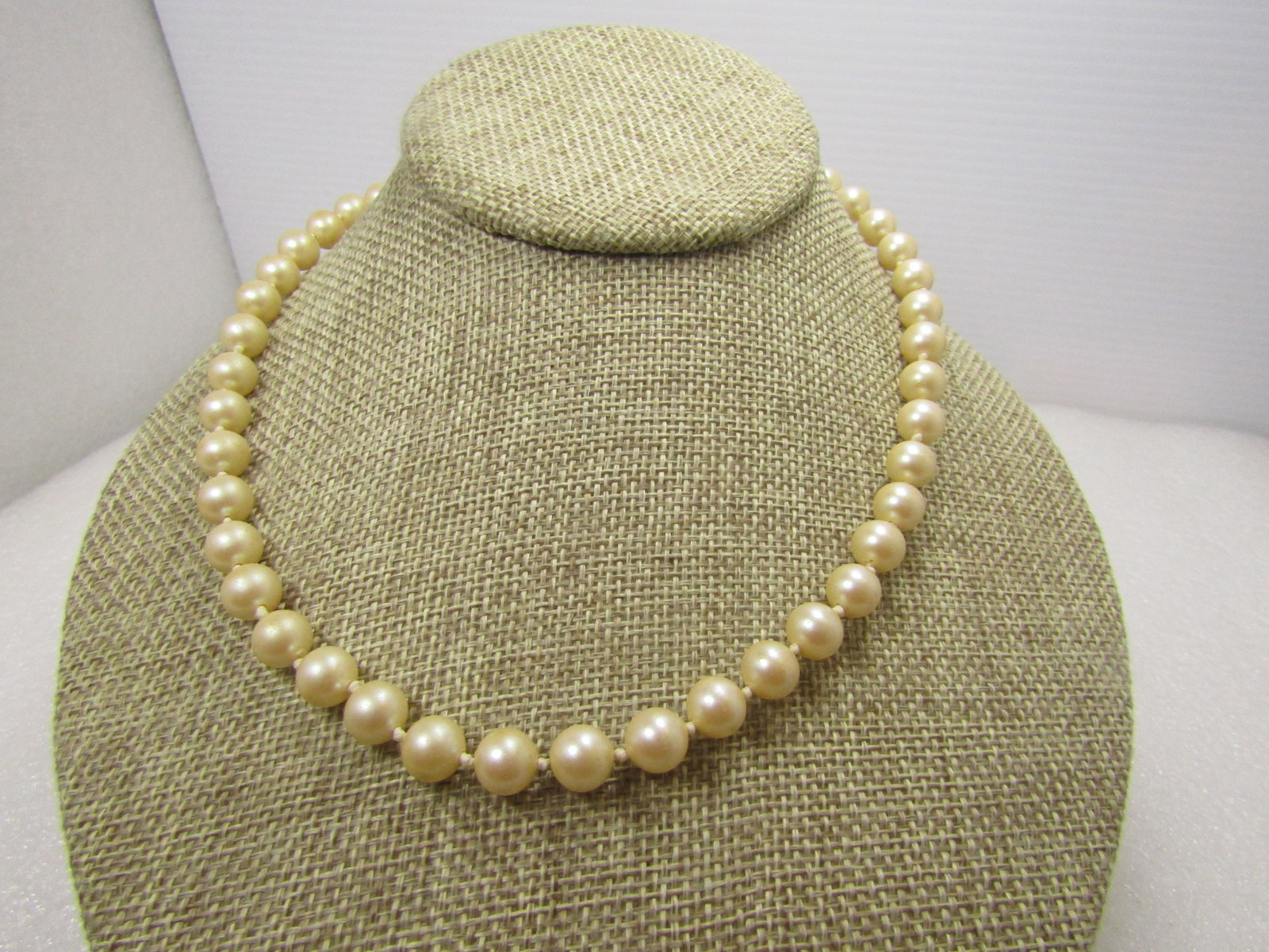 Vintage Knotted Pearl Necklace, 7.8mm, 24", Sterling Filigree Clasp, 1940's: Vintage Knotted Pearl Necklace, 7.8mm, Sterling Filigree Clasp, 1940's. 24". The pearls could be cultured pearls - not known for certain. They do not have wear on them and this is in very good conditi
