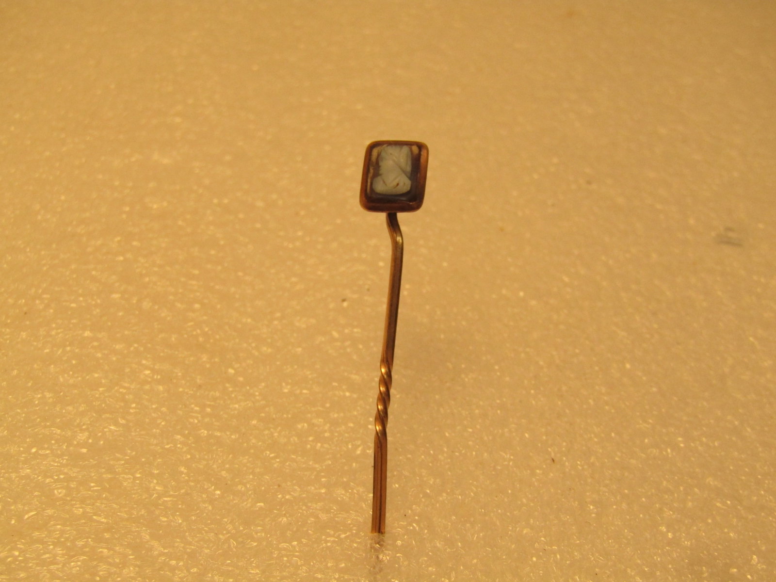 Antique 10kt Gold and GF Cameo Stick Pin, 1800's-1910's: Antique 10kt Gold and GF Cameo Stick Pin, 1800's-1910's. The frame ar ound the cameo tests as 10kt gold - the stick pin is 10kt G.F.. The pin is appx. 2.25" long and the topper is appx. 9mm tall and 7