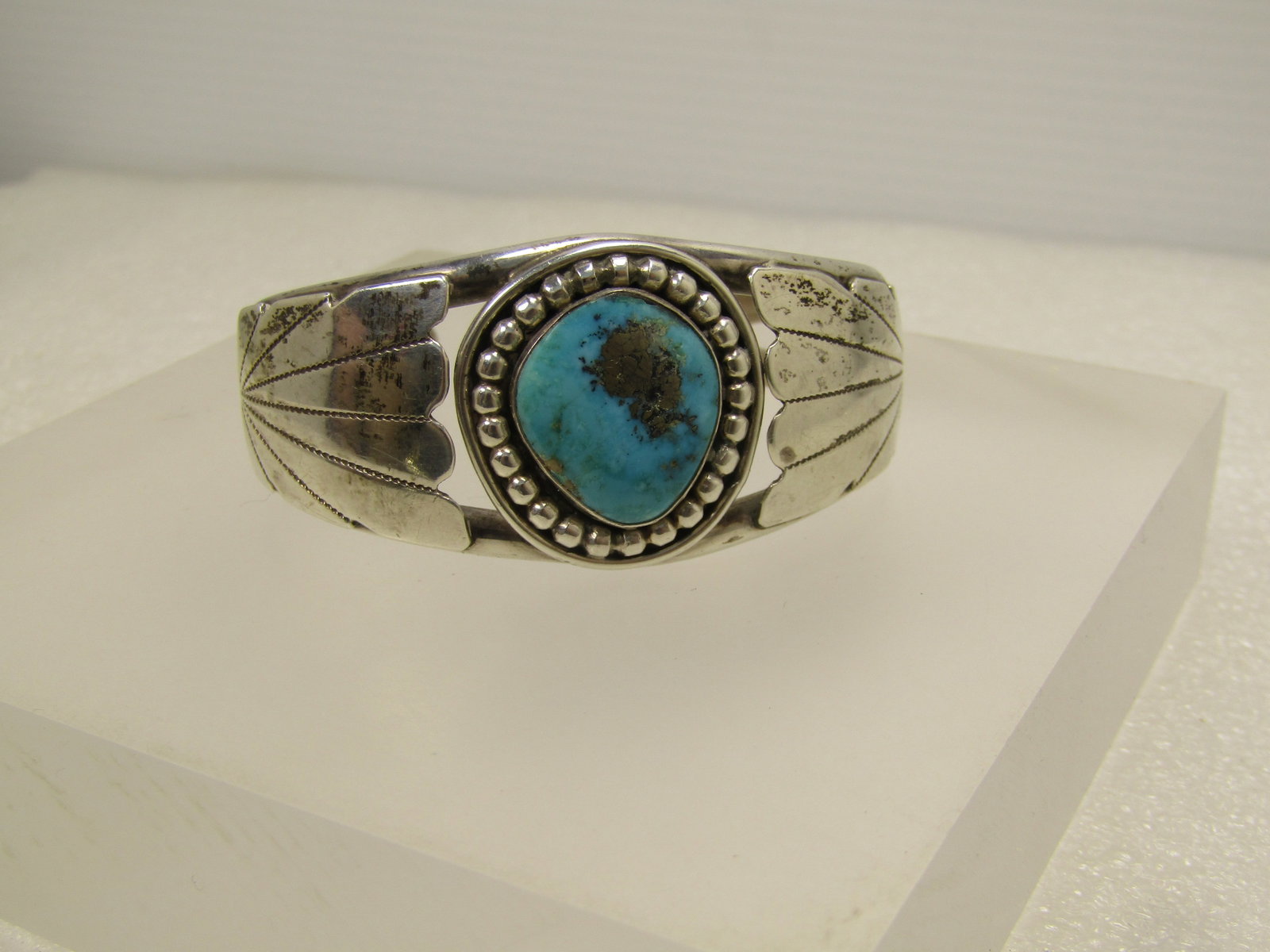 Vintage Sterling Southwestern/NavaJo Cuff Bracelet, Sz. 6, 1960's-1980's: Vintage Sterling Southwestern/NavaJo Cuff Bracelet, Sz. 6, 1960's-1980's is the estimated age based on the estate this came from. This has a turquoise bezel-set stone with a silver beaded channel set 