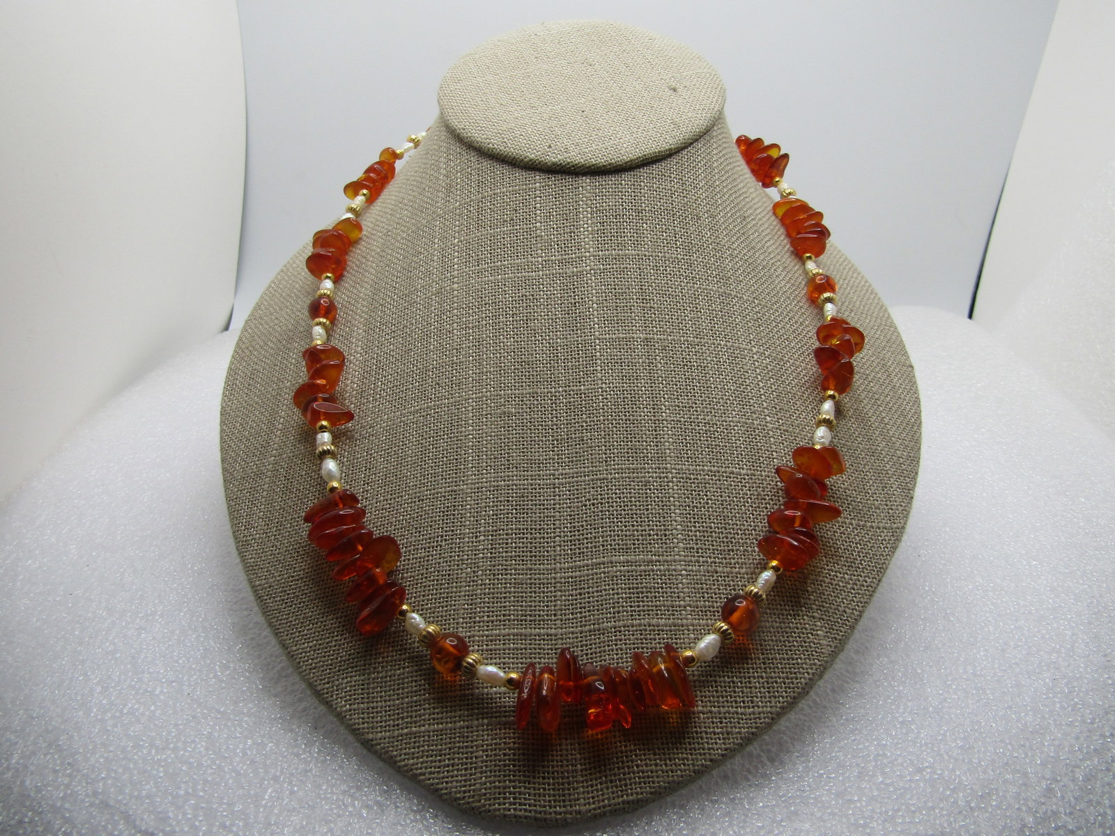 Vintage Baltic Amber Pearl Necklace, 20", Box Clasp, 1960's-1970's: Vintage Baltic Amber Pearl Necklace, 20", Box Clasp, 1960's-1970's. Clusters of amber nuggets with freshwater pearls and gold fluted beads. There are also three 7mm roumd beds. Textured 1/2" round box