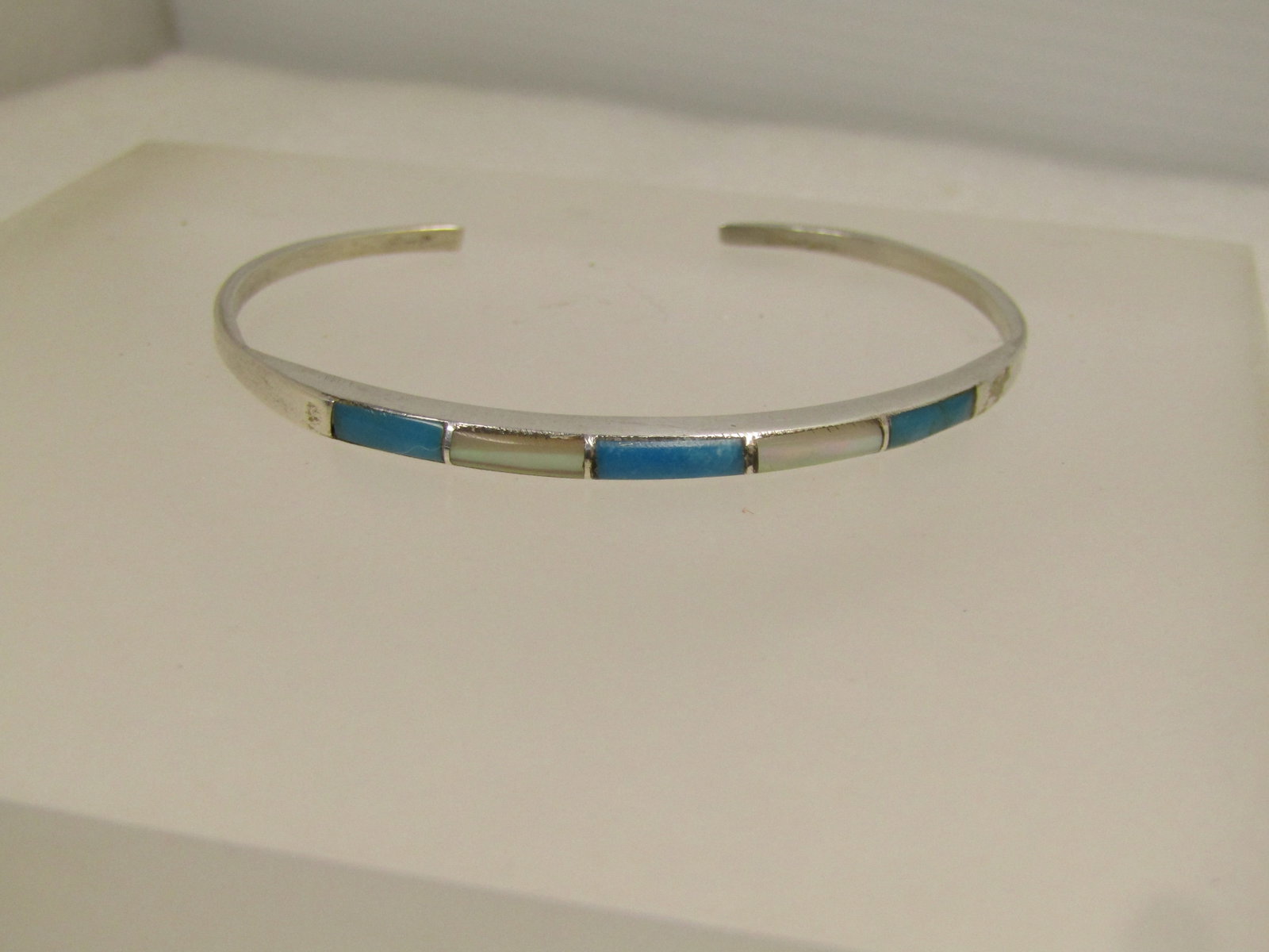 Vintage Sterling Turquoise Mother-of-Pearl Cuff Bracelet, 6.25", 1970's-1980's: Vintage Sterling Turquoise Mother-of-Pearl Cuff Bracelet, 6.25", 1970's-1980's. This has alternating three turquoise inlaid sections with white mother-of-pearl between the turquoise. The bracelet is