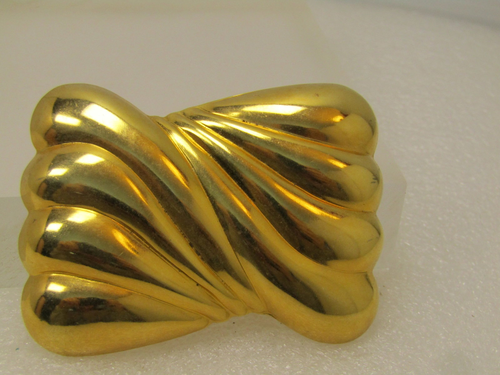 Vintage Curved Rectangular Brooch, 1980's,: Vintage Curved Rectangular Brooch, 1980's. This is 3" wide and 2" tall with a rectangular shape with curved, domed wavy accents set in two sections that meet in the middle. Gold tone with long locking