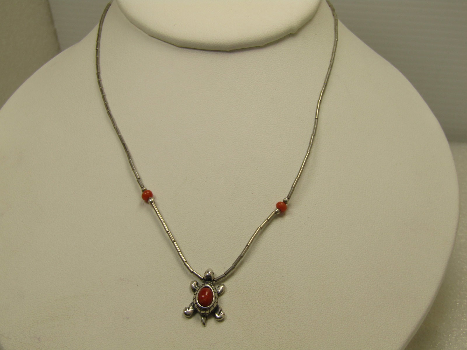 Vintage Sterling Southwestern Turquoise Necklace with Coral, 15" 1980's-1980's: Vintage Sterling Southwestern Turquoise Necklace with Coral, 15" 1980's-1980's. This has tubular sterling beads that are appx. 1mm wide with a 3.5mm round red coral bead on each side of the turtle