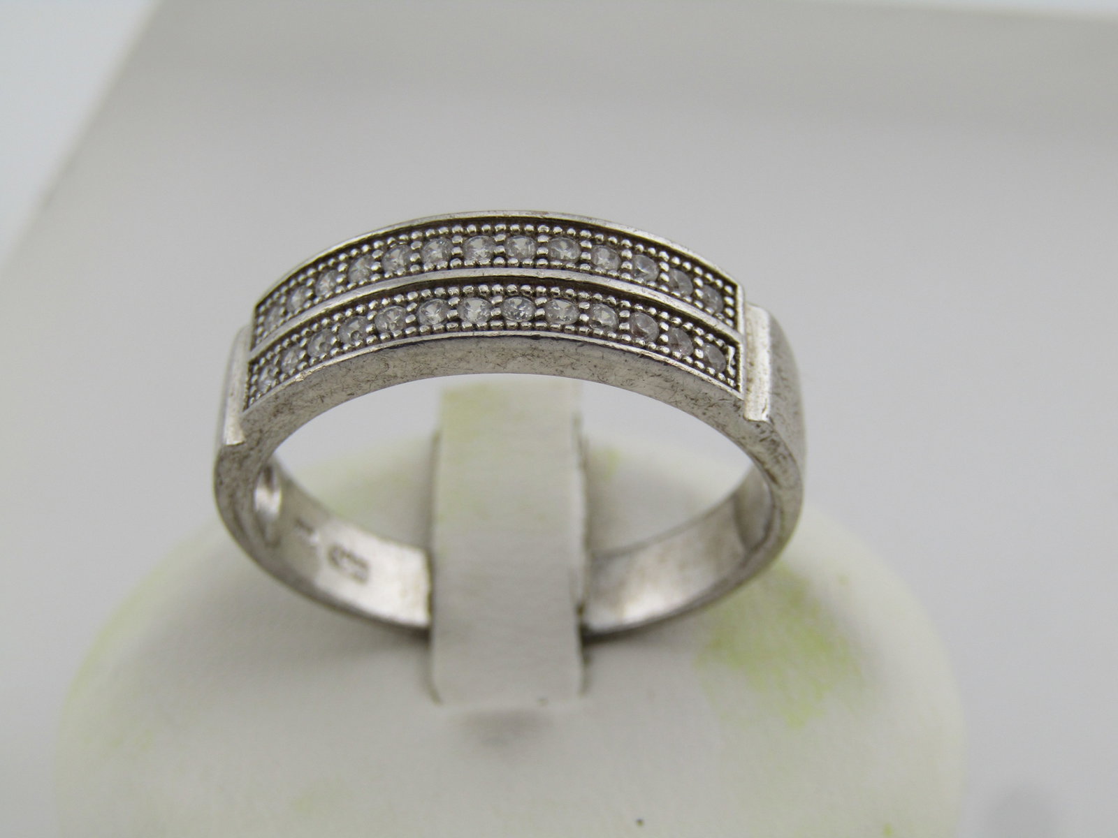 Vintage Sterling CZ Band Ring, Sz. 12.5, 1980's-1990's: Vintage Sterling CZ Band Ring, Sz. 12.5, 1980's-1990's. This has a two row design with milgrain accents. The ring is appx. 6.5mm down the finger and the stones cross over most of the top of the