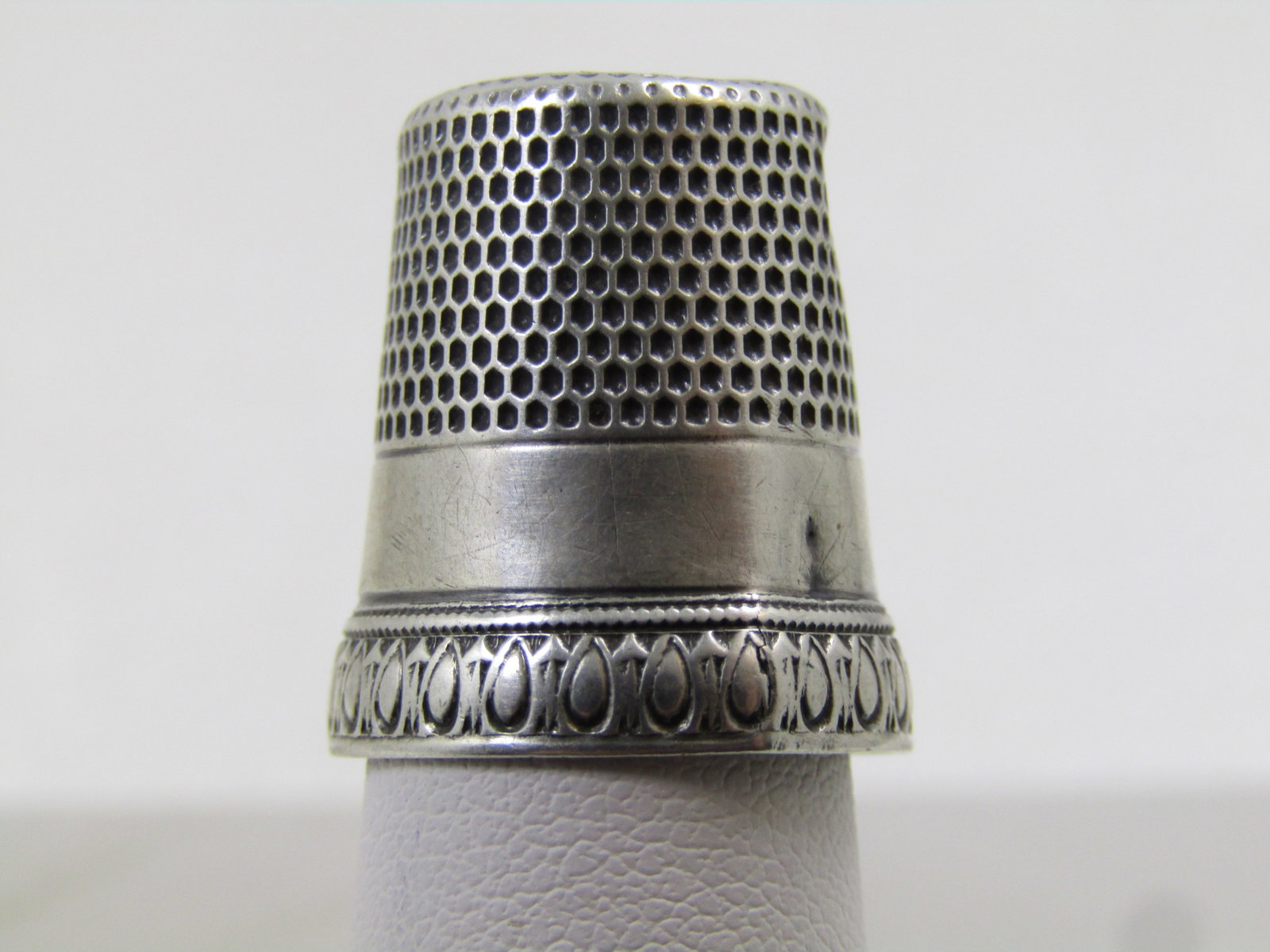 Vintage Sterling Thimble, Sz. 12, Victorian: Vintage Sterling Thimble, Sz. 12, Victorian. This is marked with patent date of May 31 98 and it is not 1998 but the prior century. It does have some wear. It has a raised lower band at the bottom wit
