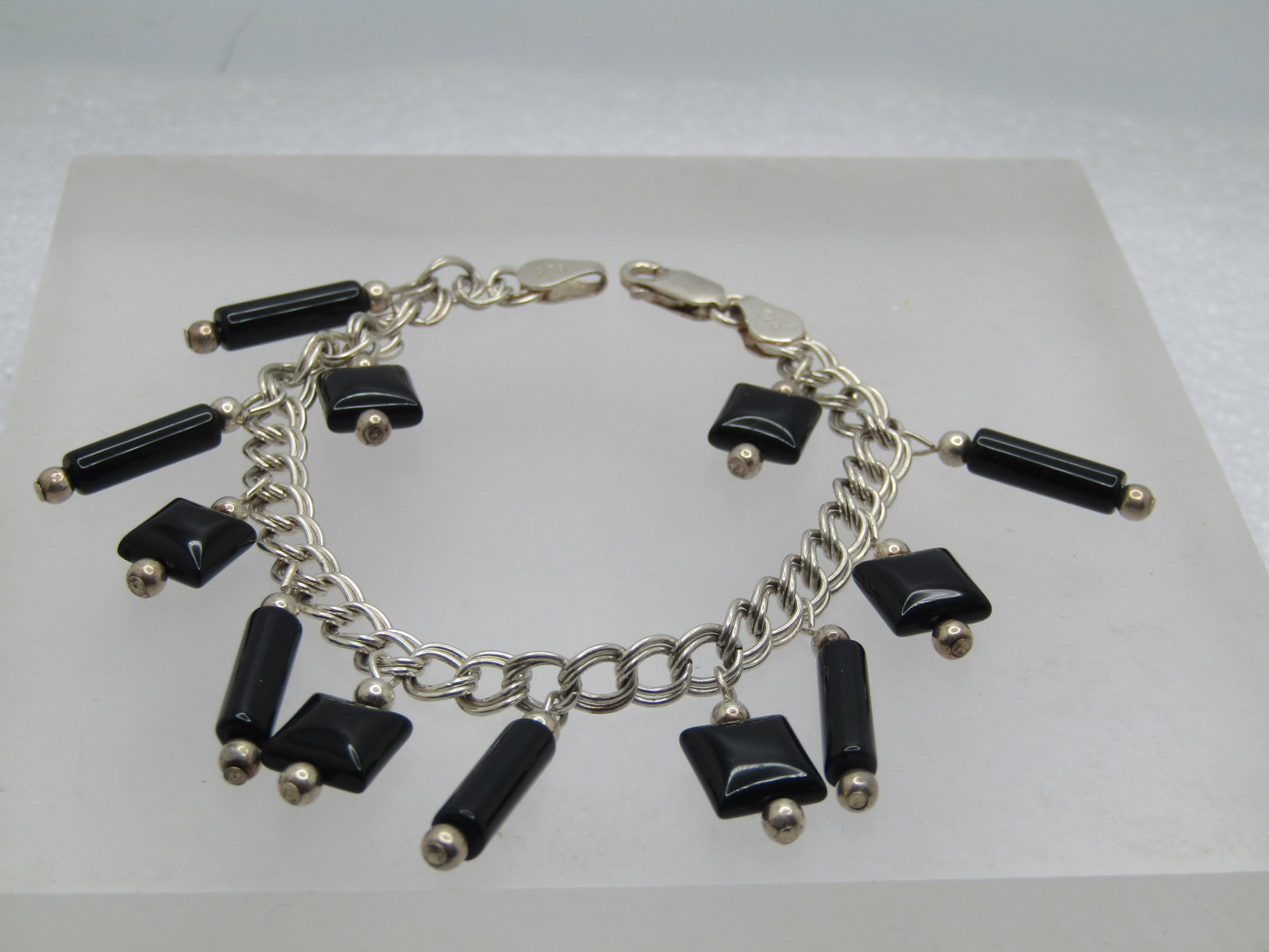 Vintage Sterling Black Onyx Dangle Bracelet, 7" , 1980's-1990's: Vintage Sterling Black Onyx Dangle Bracelet, 7". This has 5/8" and appx 3.9mm wide onyx bar beads and 8mm pillowy onyx square beads - each with a silver bead on top and bottom of the dangle. The brace