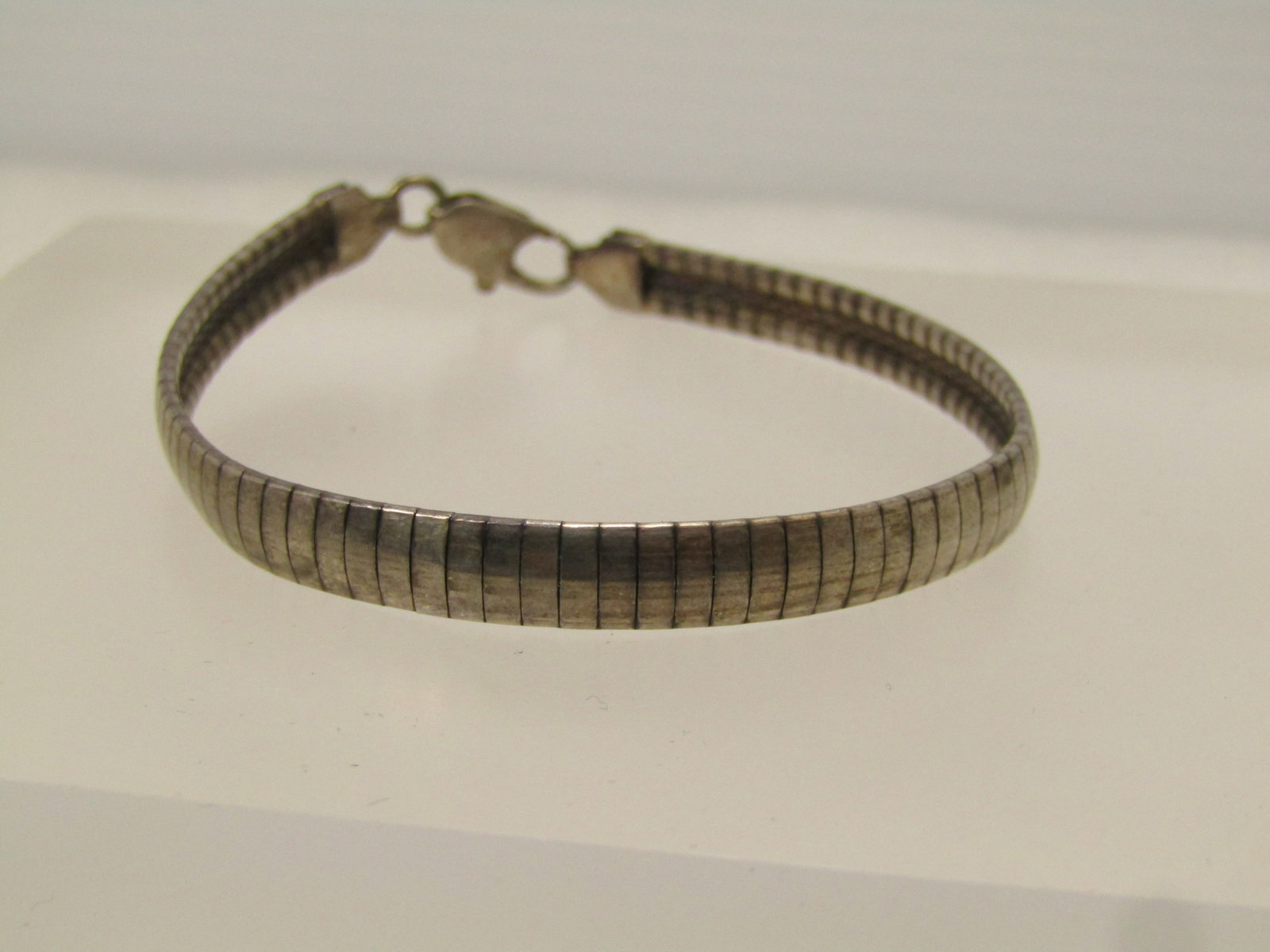 Vintage Sterling Omega Bracelet, 6mm, 7.25", 1980's-1990's: Vintage Sterling Omega Bracelet, 6mm, 7.25", 1980's-1990's. This is marked .925 and signed Italy. It tests as sterling too with an appx. weight of 10.98 grams. It has a lobster clasp with oxidation