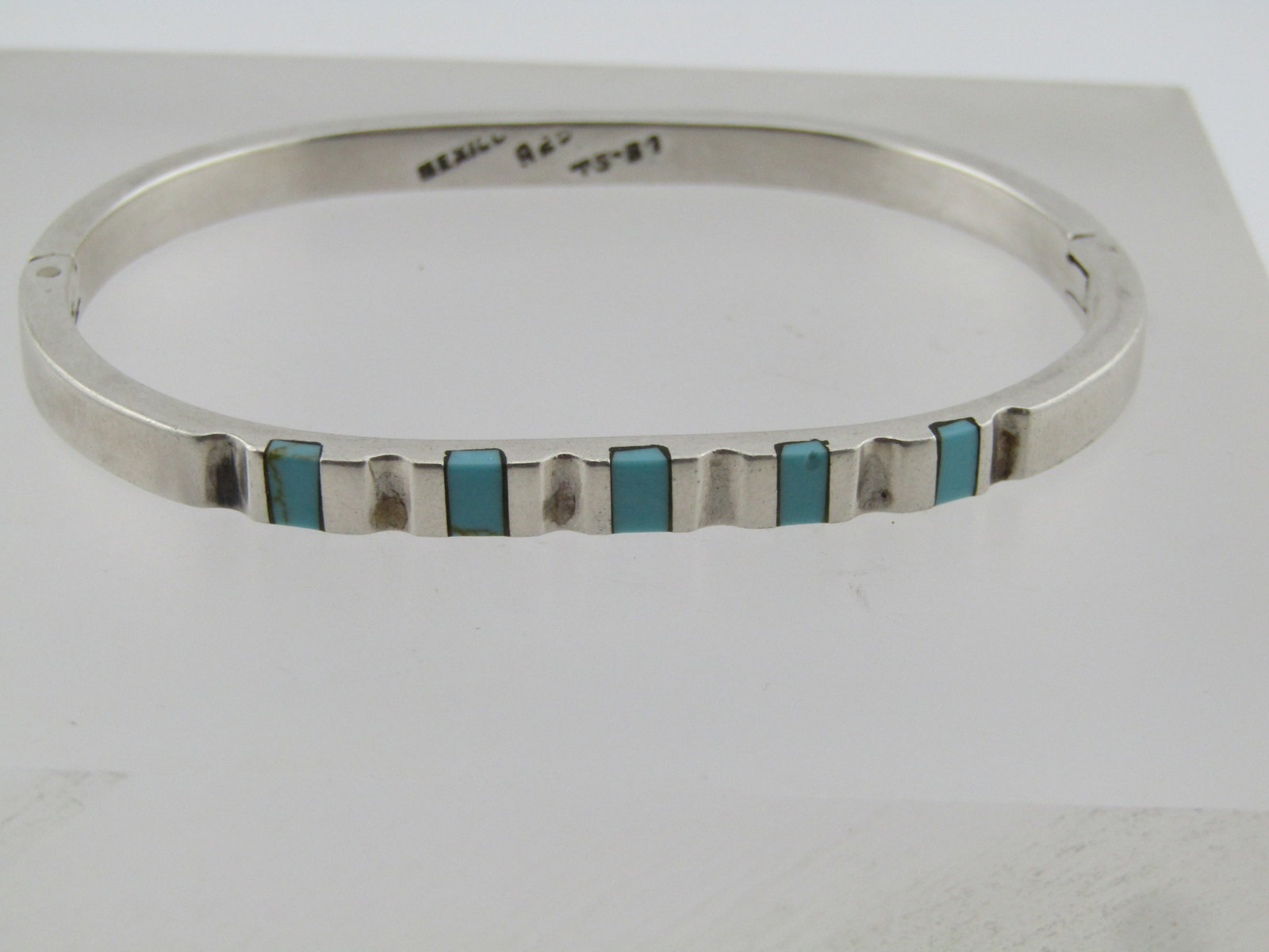 Vintage Sterling Turquoise Hinged Cuff Bracelet, 7.25", 1980's, Mexico: Vintage Sterling Turquoise Hinged Cuff Bracelet, 7.25", 1980's, Mexico. It is marked Mexico, .925 and TS-87. This is appx. 5mm wide with five inlaid sections of rectangular turquoise pieces and