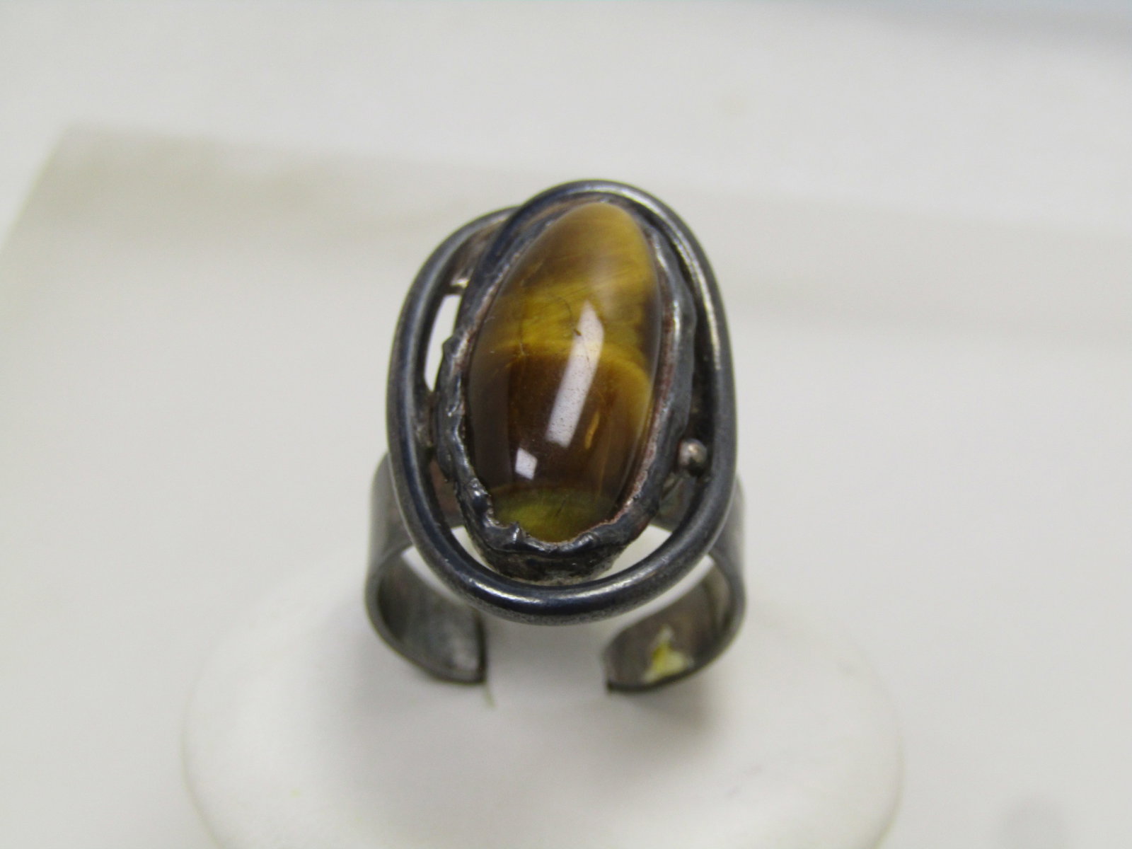 Vintage Tiger's Eye Ring, Adjustable, Sterling and Plated, Southwestern/Mod, 1970's-1980's: Vintage Tiger's Eye Ring, Adjustable, Sterling and Plated, Southwestern/Mod, 1970's-1980's. this has a elongated tiger's eye cabochon that is bezel-set in a rugged looking bezel, designed that way. Th