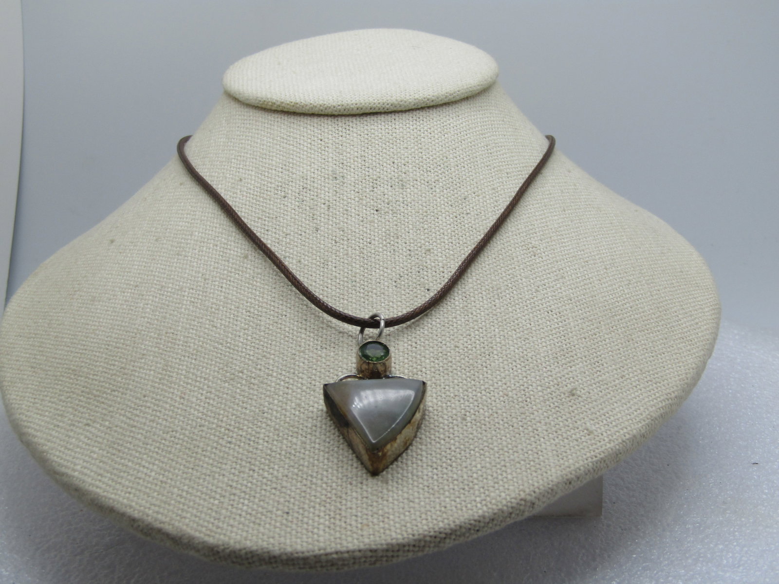 Triangular Agate and Rhinestone Necklace, 17"-19", 1990's: Triangular Agate and Rhinestone Necklace, 17"-19", 1990's. The pendant is appx. 1.75" long and 3/4" wide. It is silver tone metal, the agate is bezel-set and is appx. 19mm down each side, triagular sh