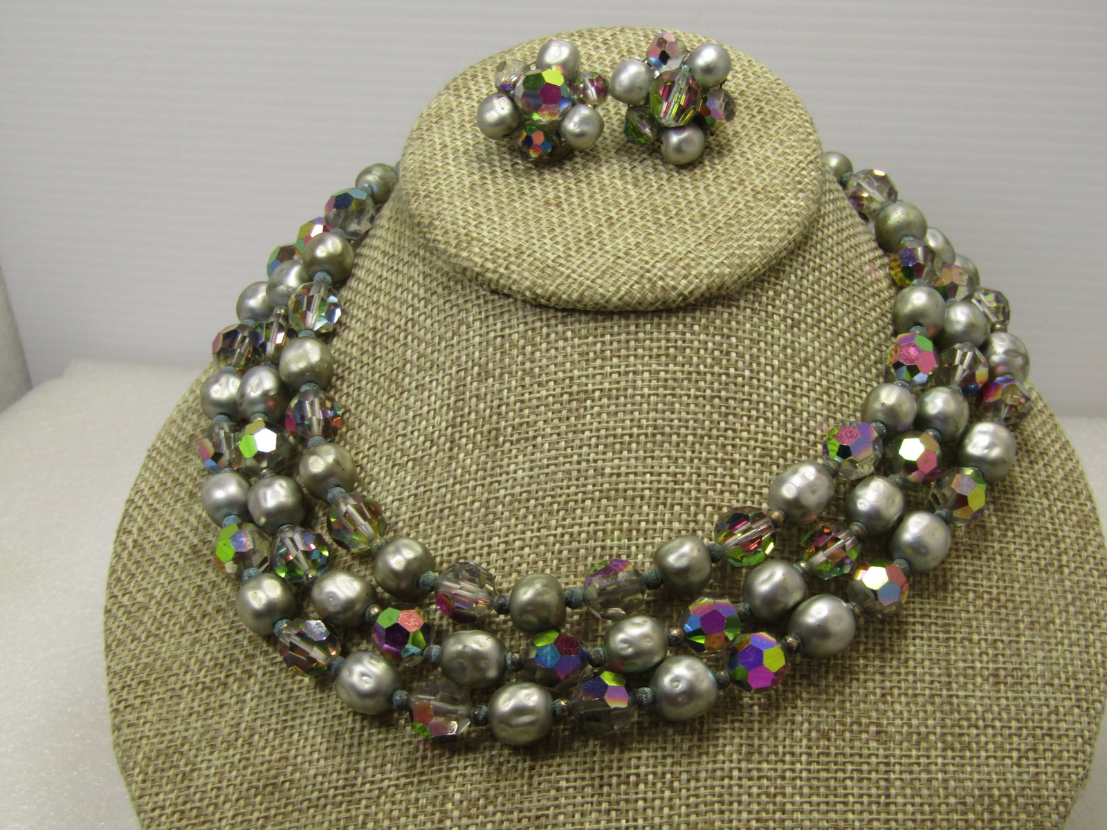 Vintage AB Crystal and Silver Beaded Necklace and Earrings, Triple strand, 1940's: Vintage AB Crystal and Silver Beaded Necklace and Earrings, Triple strand, 1940's. The neckalce has shimmery pink and purple aurora borealis crystal faceted beads with a matte silvery dimped bead betw