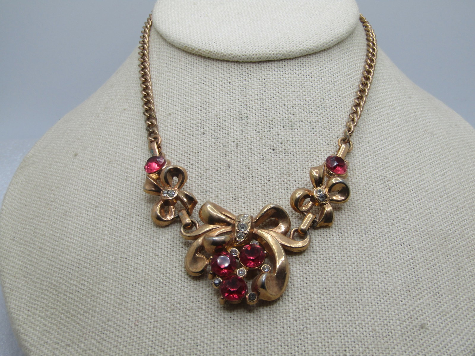 Vintage Lisner Pink and Clear Rhinestone Bow Necklace, 14.5", 1940's-1950's: Vintage Lisner Pink and Clear Rhinestone Bow Necklace, 14.5", 1940's-1950's. Three bows at the front of the necklace, each with pink and clear rhinestones and rhinestones in the center of the bow. The