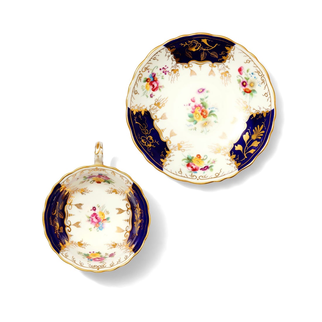 Cauldon China Cup and Saucer: Features intricate decoration and a delicate ring handle. The interior of the cup and the center of the saucer are adorned with colorful floral sprays. Marked "ESTP 1774 CAULDON CHINA ENGLAND"