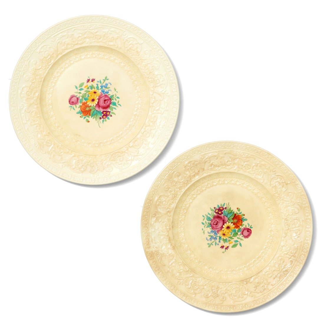 Pair of Royal Cauldon Plates: A charming pair of Royal Cauldon plates. Each plate features floral bouquets at the center, surrounded by an ornate border. Marked "Royal Cauldon England Est 1774". Measurements reflect one plate.