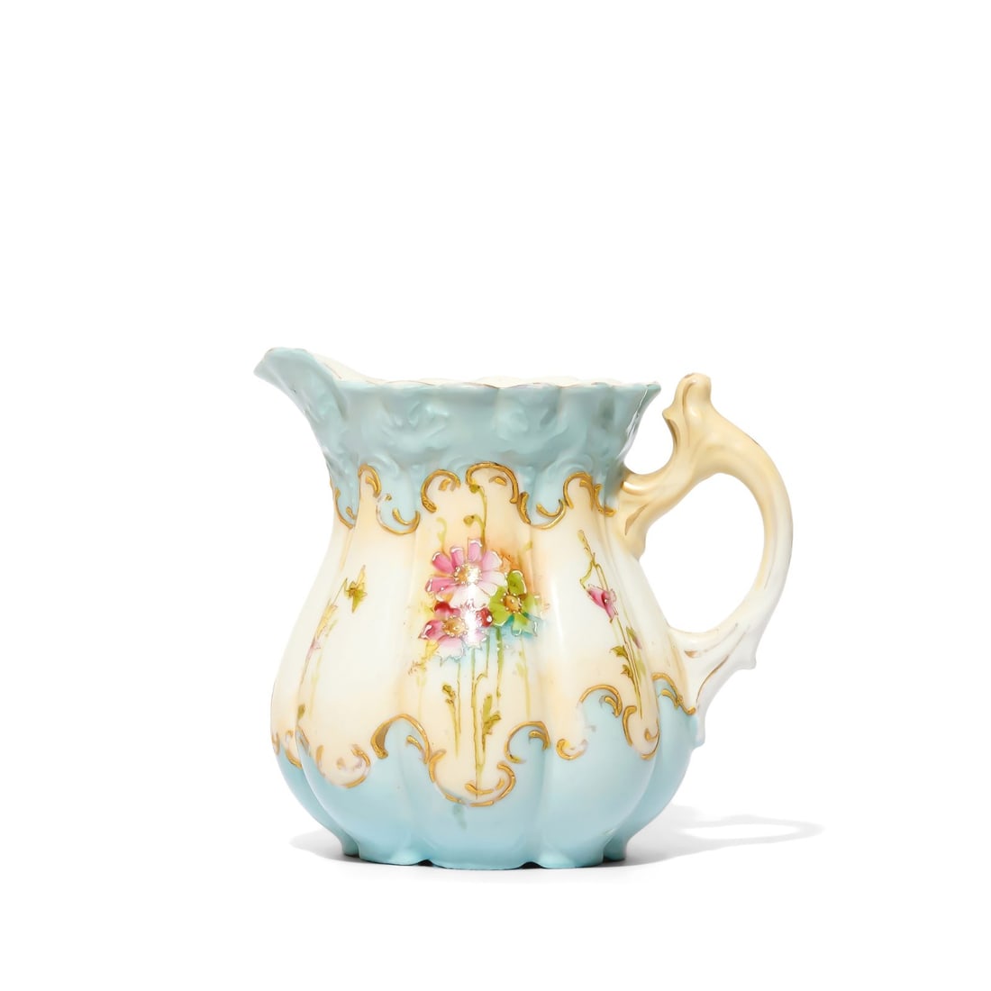 Petite Pitcher: Pale blue petite pitcher with fluted design, creating a scalloped effect on the rim. Disclaimer: This item is offered for sale as a pre-owned, vintage, antique, estate, or consigned item. We do not