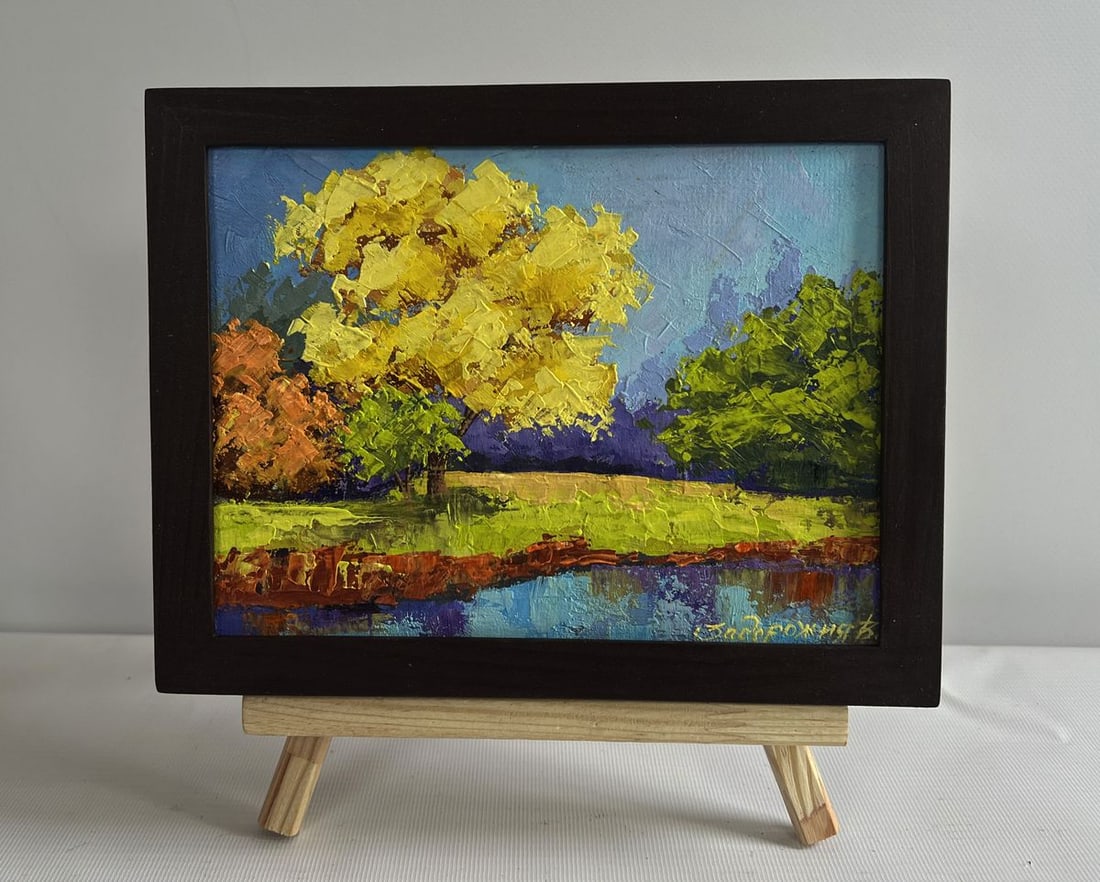 Oil painting In the autumn forest V. Zadorozhnya: NoAAA4628The oil painting on cardboard titled "In the Autumn Forest" captures the essence of the golden season, where nature transforms into a vibrant tapestry of warm hues. The artwork presents a ser