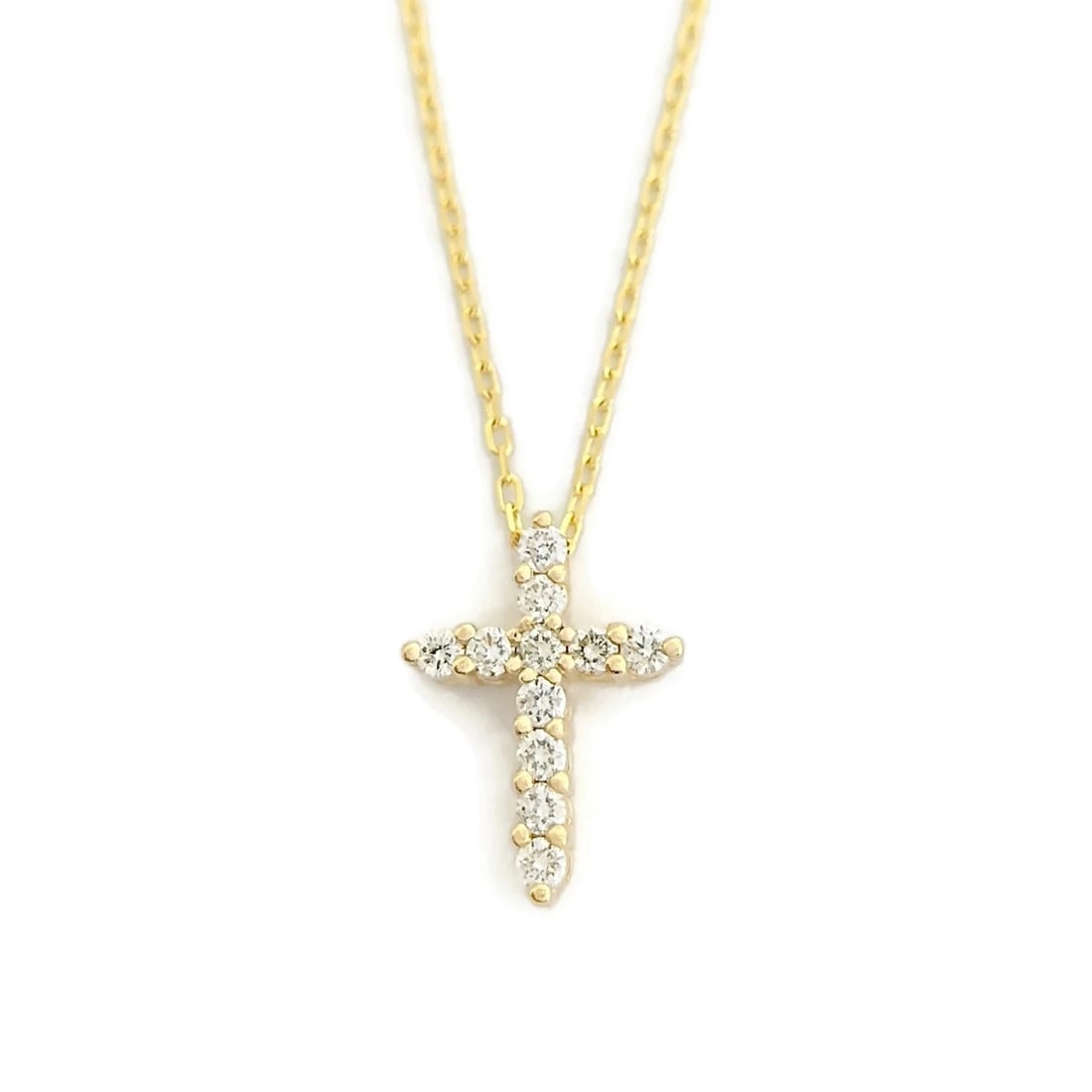 Diamond Cross Pendant Necklace 14K Yellow Gold, .52 CTW: Diamond Cross Pendant Necklace 14K Yellow Gold, .52 CTW This is a beautiful diamond cross necklace. Please let us know if you have any questions. Diamonds: 11 round brilliant cuts .52 ctw, H-I, SI1 Me
