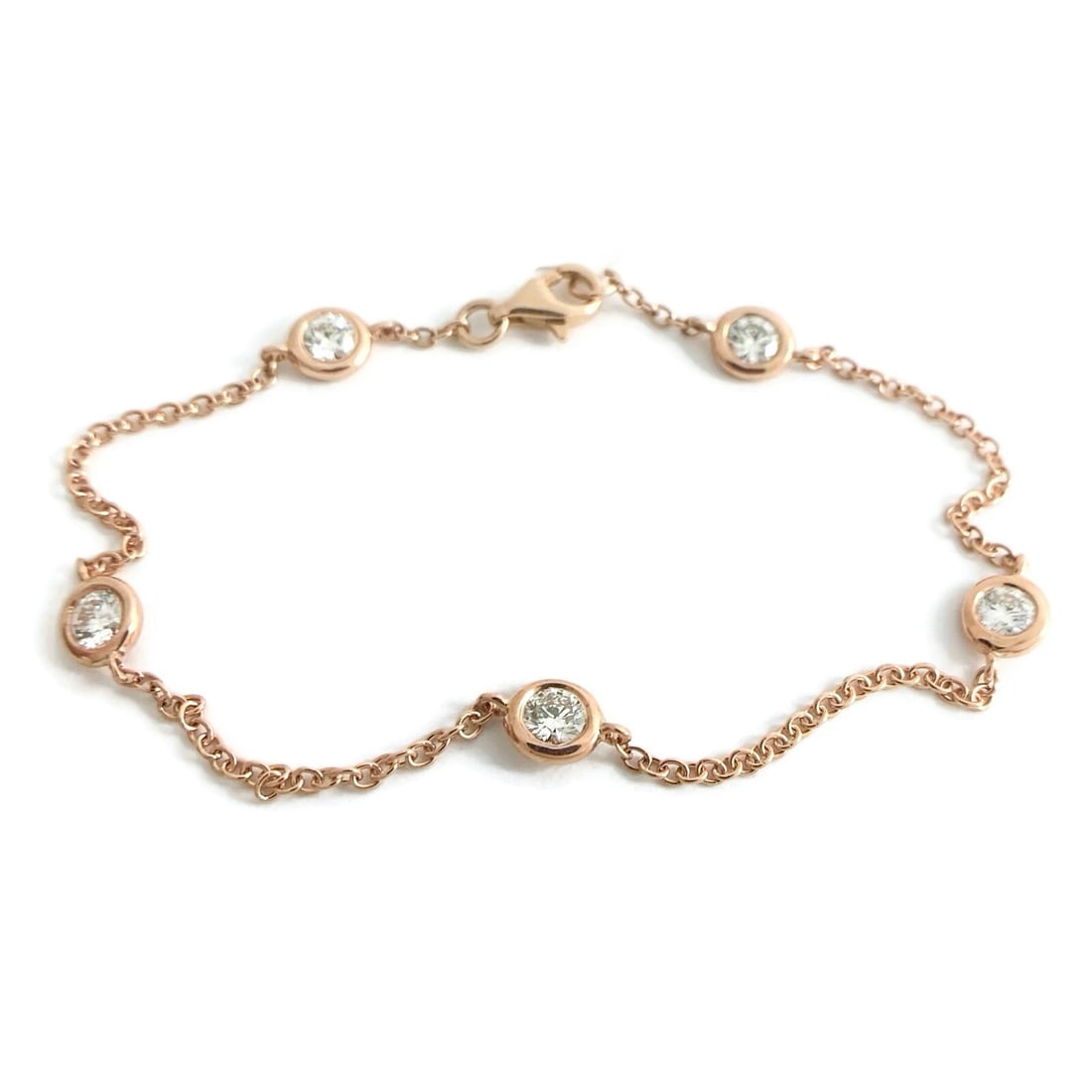 Round Bezel Diamond Station Bracelet 14K Pink Rose Gold 1.01 CTW, 2.63 Grams: Round Bezel Diamond Station Bracelet 14K Pink Rose Gold 1.01 CTW, 2.63 Grams This is such a gorgeous bracelet! Please let us know if you have any questions. Diamonds: 5 round brilliant cuts, 1.01 ctw,