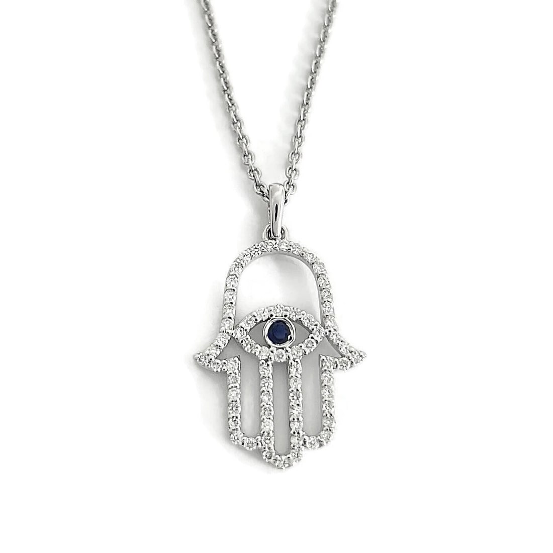 Blue Sapphire Diamond Hamsa Hand Evil Eye Pendant Necklace 14K White Gold: Blue Sapphire Diamond Hamsa Hand Evil Eye Pendant Necklace 14K White Gold This is a beautiful necklace! Please let us know if you have any questions. Diamonds: 65 rounds, .35 ctw, G, SI1 Gemstone: 1 r