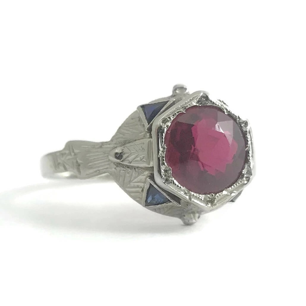 Antique Art Deco Lab-Created Ruby Blue Sapphire Ring 18K White Gold, 2.96 Grams: Antique Art Deco Red Ruby Blue Sapphire Ring 18K White Gold, 1.74 CTW, 2.96 Grams This is a gorgeous unique ring! Please let us know if you have any questions! Circa: 1920's - 1930's Gemstones: 1 roun